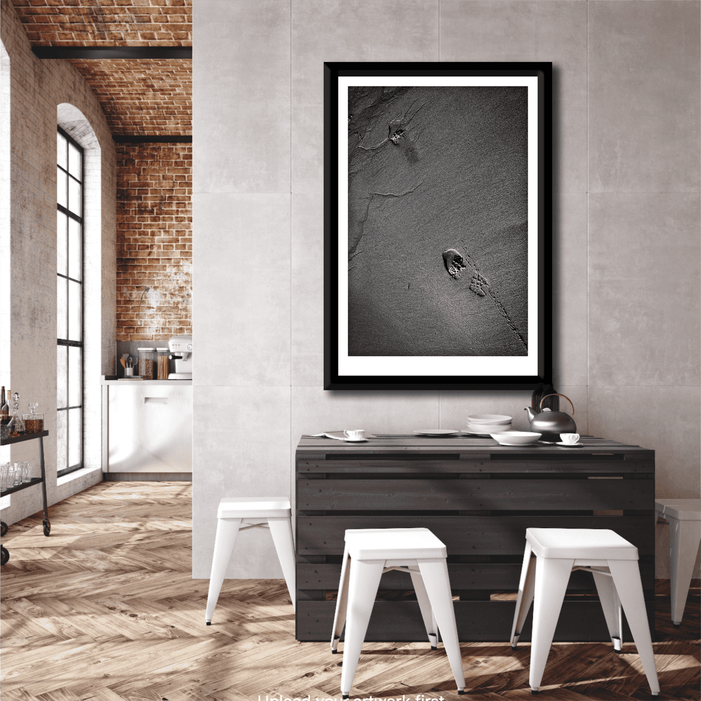 Traces #1 vertical black and white sand and footprint artwork displayed in a rustic modern kitchen, enhancing natural interior aesthetics.
