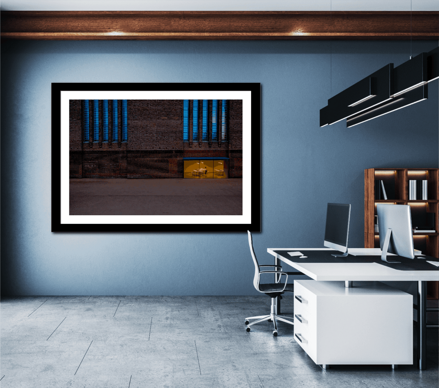 Large framed print of The Tate Modern – A Study in Color and Line displayed in a contemporary office with blue walls, adding urban elegance to the workspace.