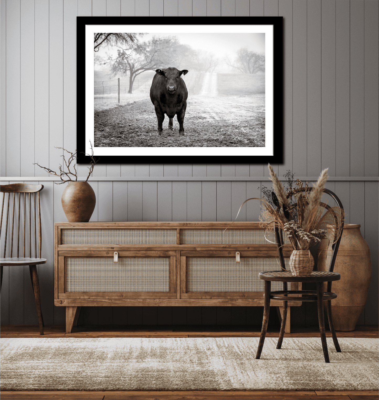 Black Angus Bull in Fog – Award-Winning Texas Ranch Photography displayed in rustic living room. Monochrome bull print adds Western charm to wall decor.