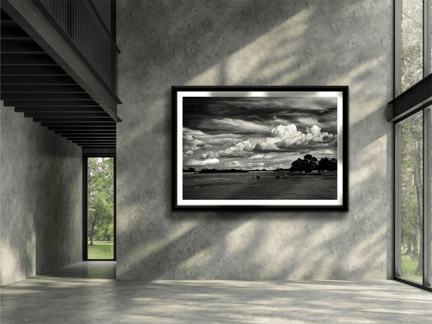 Framed fine art print 'Under a Texas Sky' featuring a cowboy at 44 Farms, Texas, showcased in a contemporary gallery-style interior.