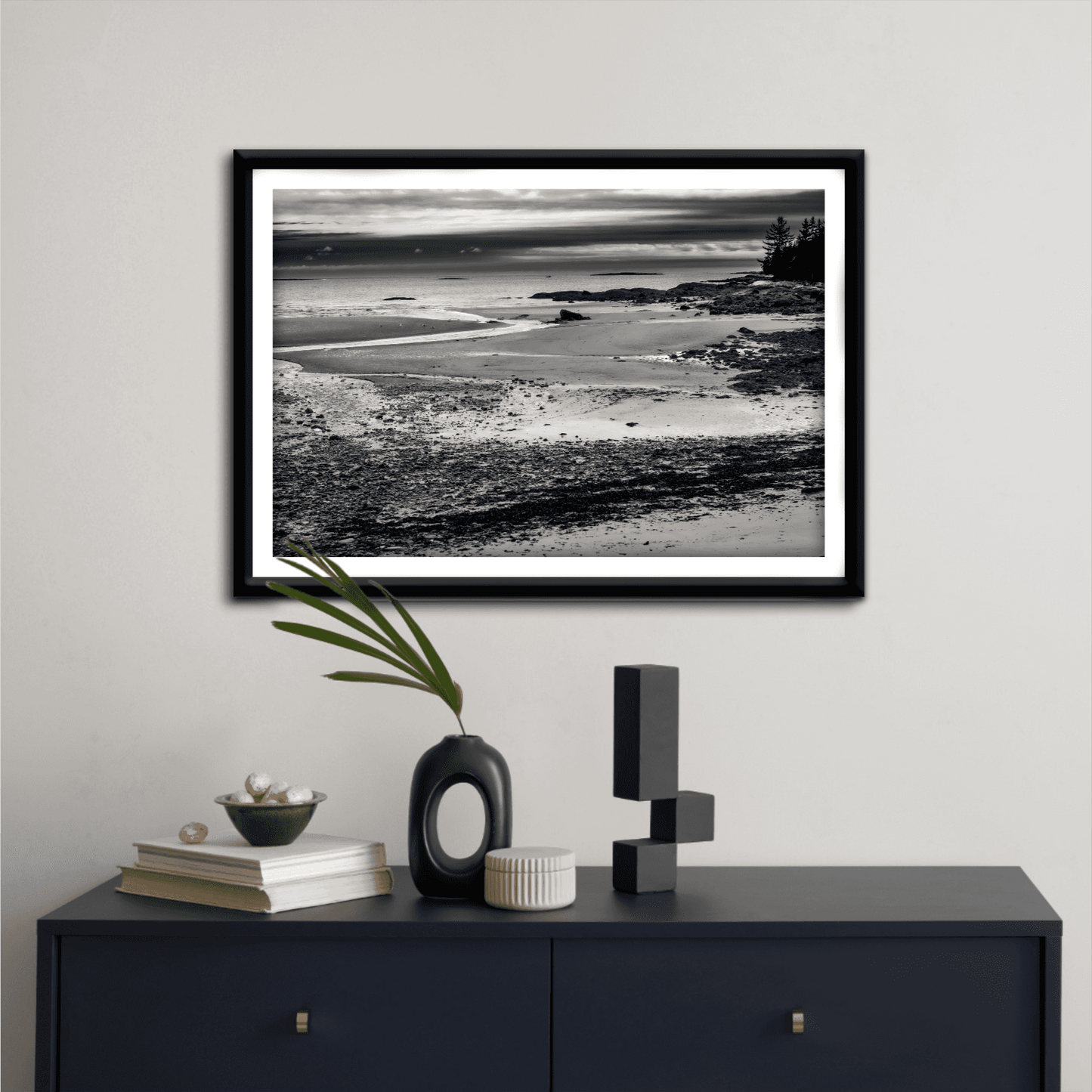 Grey Atlantic #2 – Black and White Coastal Photography in Maine displayed above a navy console table with modern decor. A refined seascape print for elegant home styling.