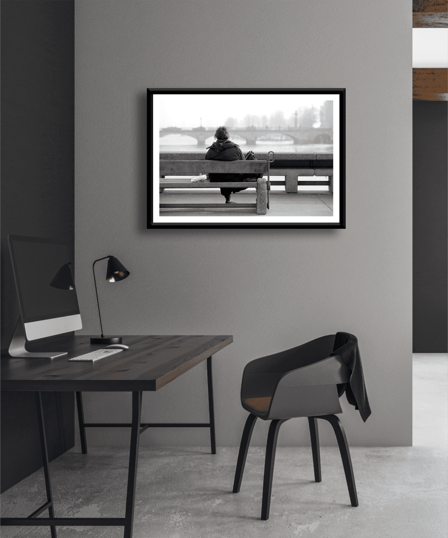 Zurich Series #6 – The Woman Overlooking the River Limmat monochrome art print by Michael Hart in a modern office setting. A minimalist European cityscape perfect for contemporary workspace decor.