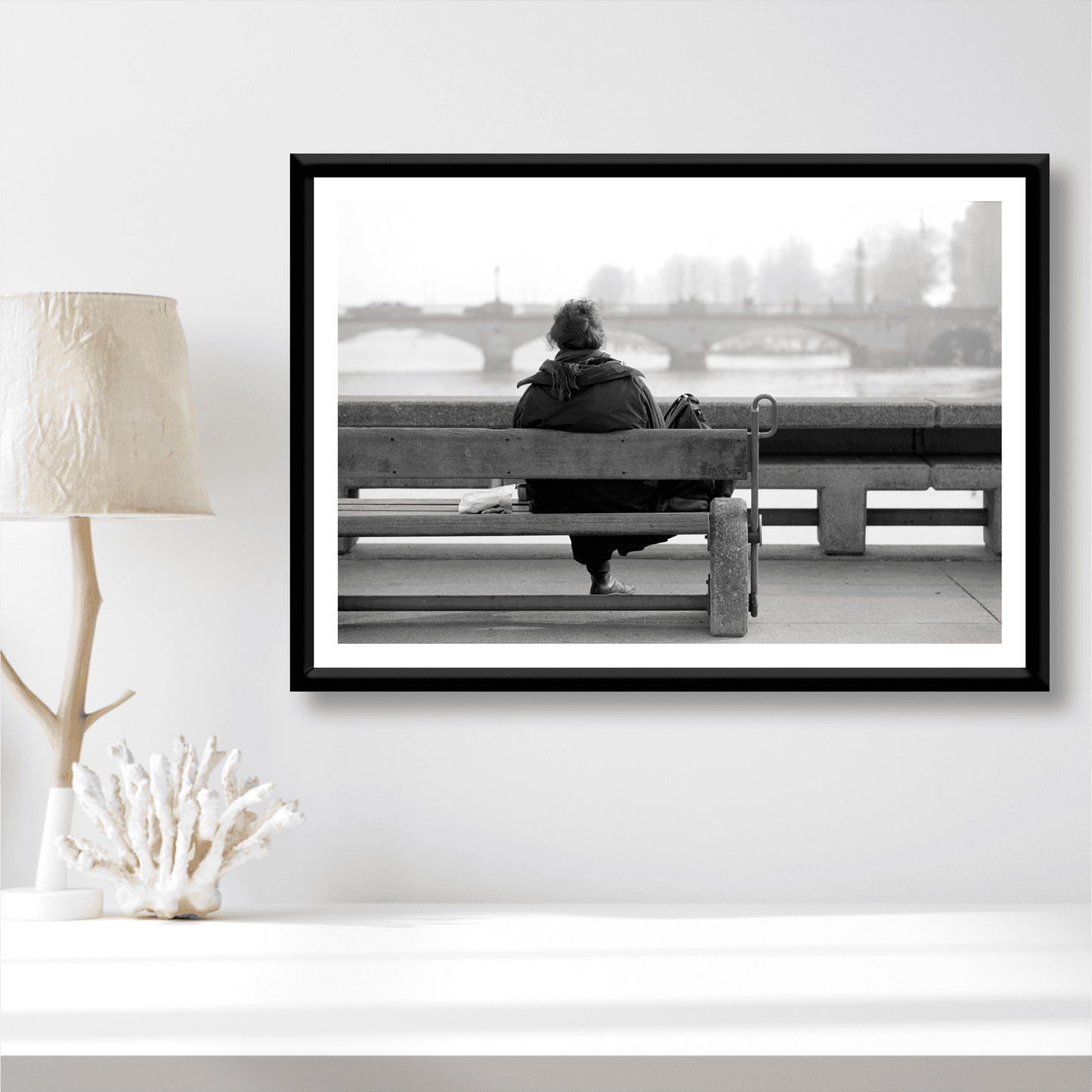 Zurich Series #6 – The Woman Overlooking the River Limmat black and white fine art print by Michael Hart styled in a coastal-themed room. A contemplative Zurich moment enhancing minimalist interior design.