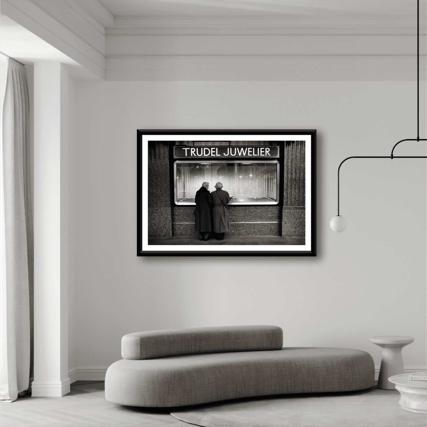 Zurich Series #7 – Window Shopping on Bahnhofstrasse framed black and white print displayed in a modern living room with minimalist decor.