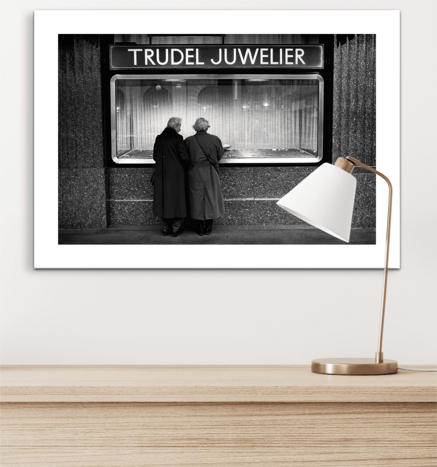 Zurich Series #7 – Window Shopping on Bahnhofstrasse fine art print with white matting placed above a wooden desk with a modern lamp.