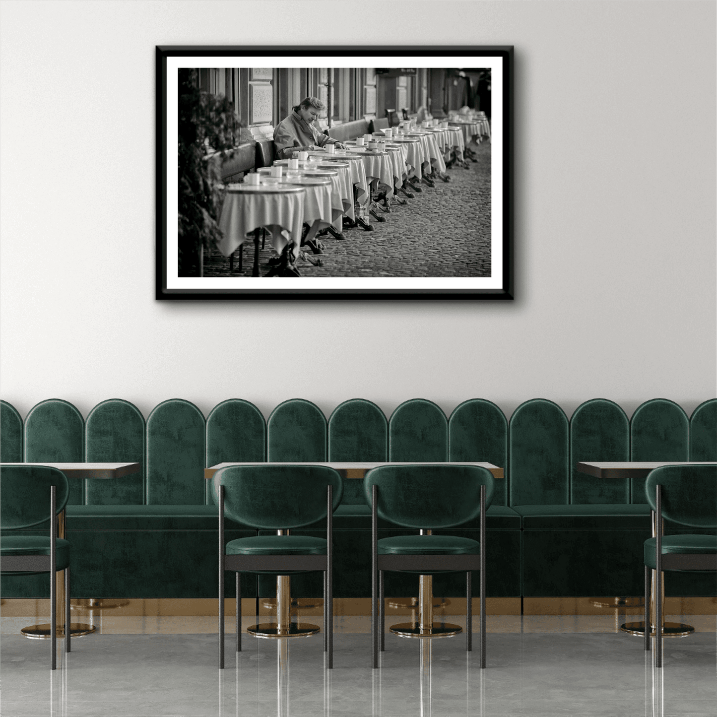 Zurich Series #3 – The Man at the Café, Zurich in Black and White – Fine Art Print by Michael Hart framed in a chic dining space. Elegant monochrome street photography ideal for upscale interior design.