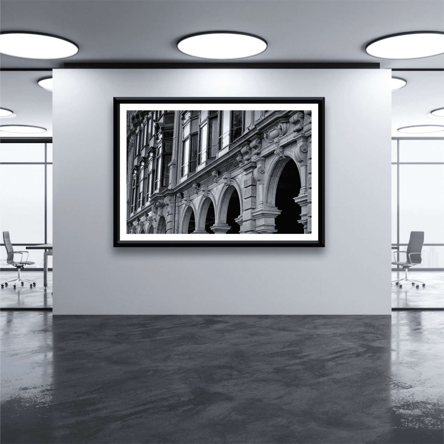 Zurich Series #4 – The Architecture Speaks fine art print by Michael Hart mounted in a modern office gallery, highlighting Zurich's historic facade in black and white.