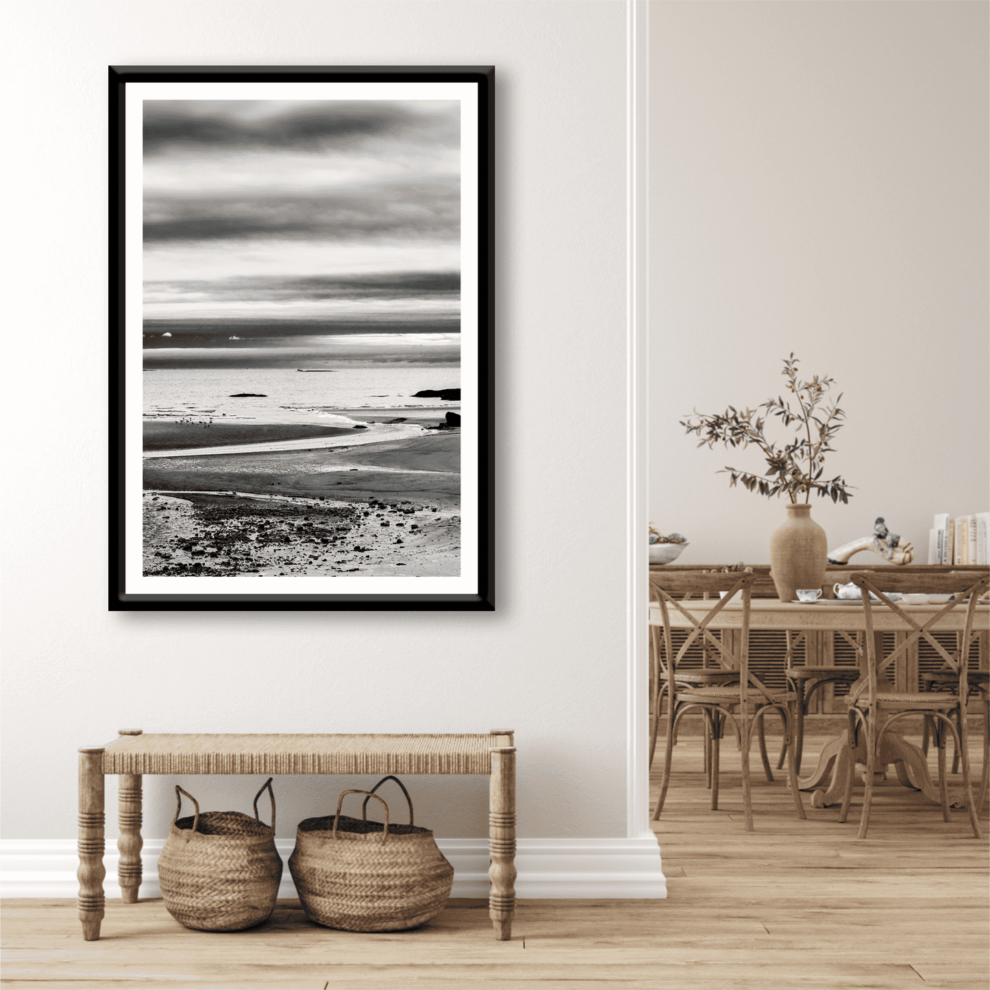 A print of a moody black and white image titled Grey Atlantic #1, moody coastal Maine image shown framed on the wall of a room settingA print of a moody black and white image titled Grey Atlantic #1, moody coastal Maine image shown framed on the wall of a room setting