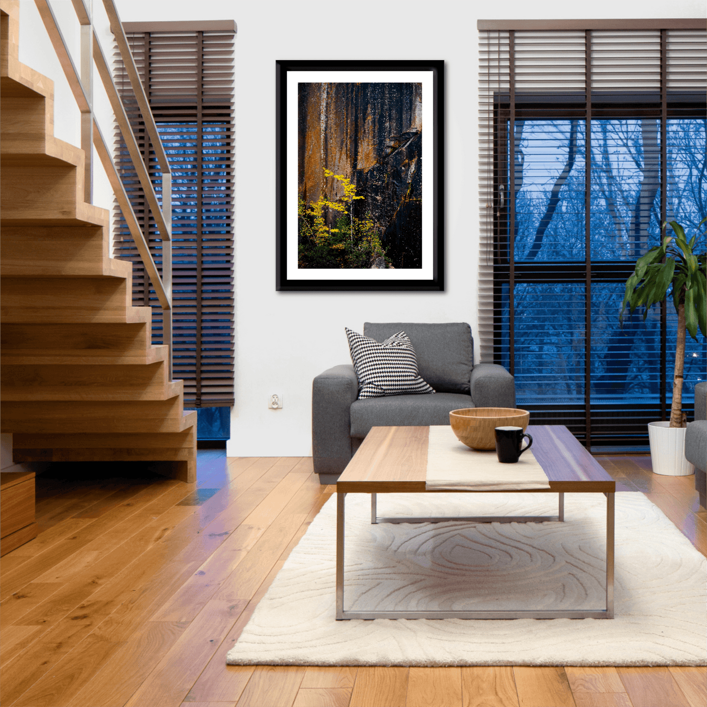 Framed Quarry Wall #2 by Michael Hart in a cozy living room with wood floors and staircase. New England Quarry Scene for stylish home decor.