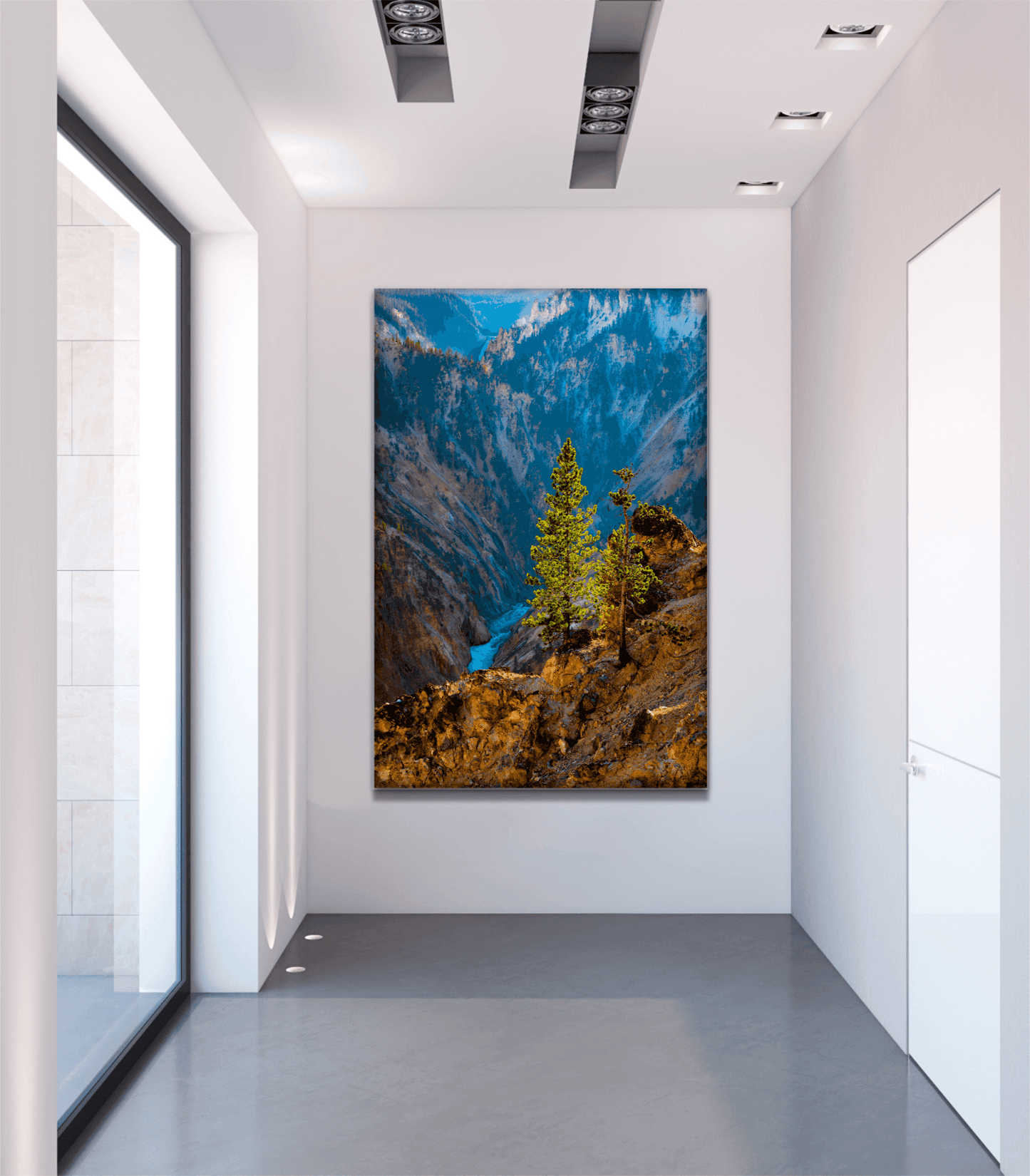 Large fine art Yellowstone photography print of a sunlit tree over canyon river showcased in a minimalist gallery hallway. Perfect for collectors.