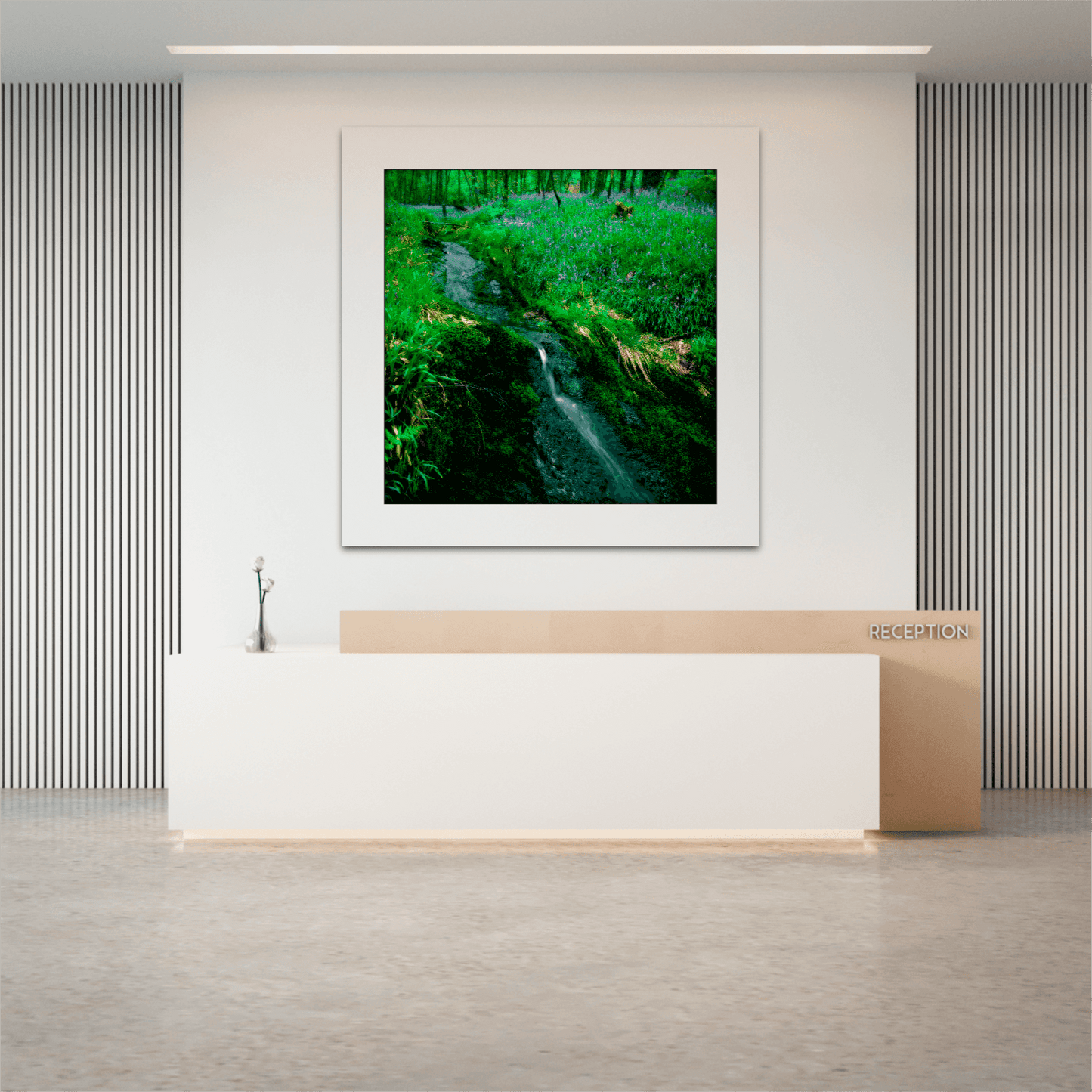 Square format Lomond Creek Scotland photography print in a minimalist office reception, highlighting a serene creek and wildflowers near Loch Lomond.