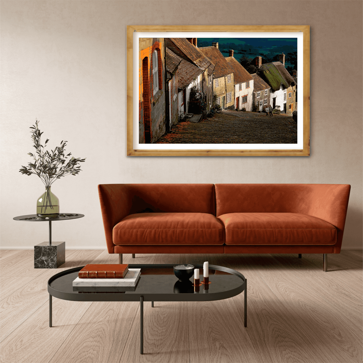 Gold Hill, Shaftesbury – A Fairy Tale Scene in Dorset fine art print displayed above a modern leather sofa in a minimalist living room setting.