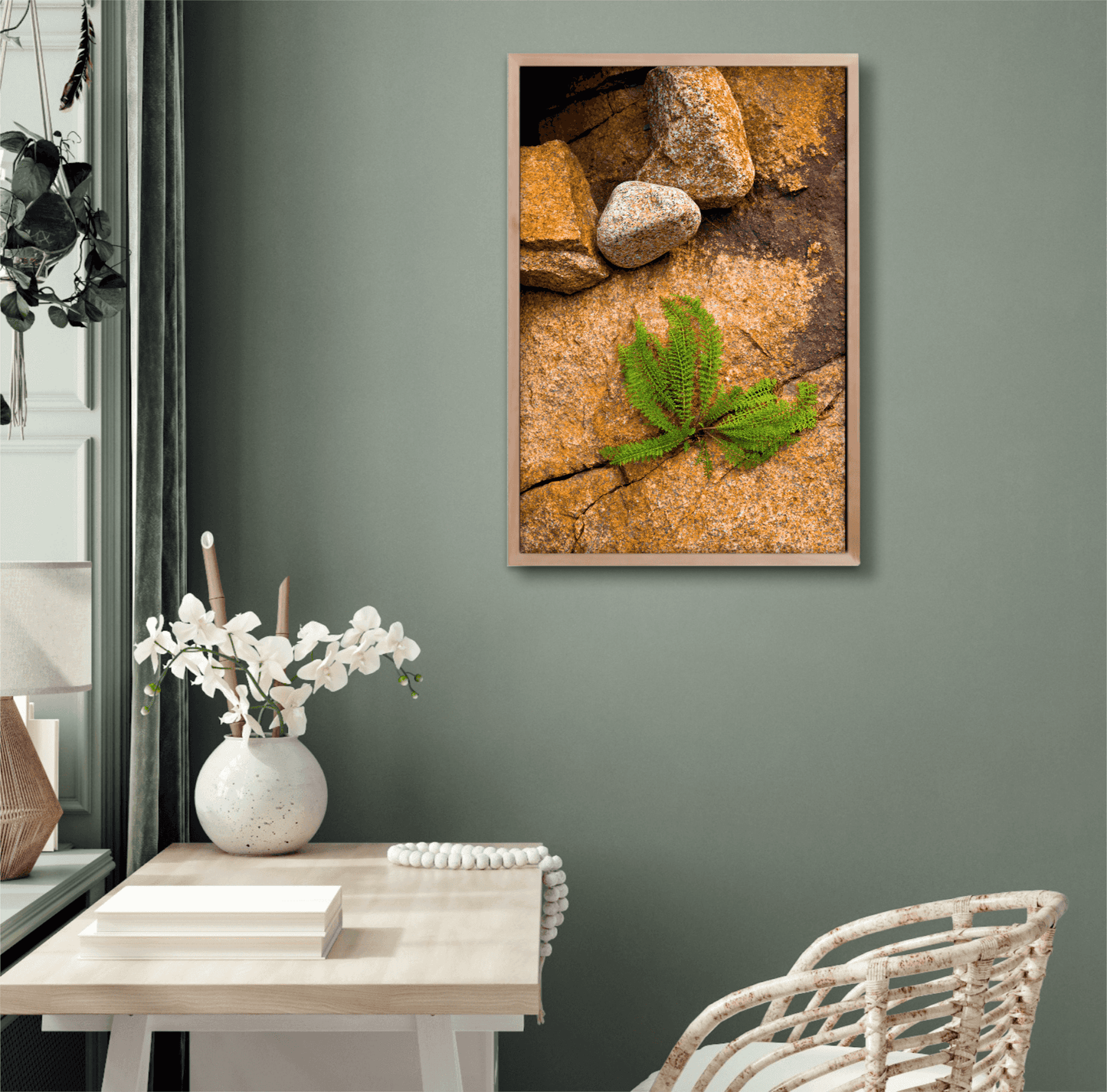 Nature Breaking Through Stone fine art print on green wall above desk, featuring Maine plant emerging from stone with natural textures and contrast.