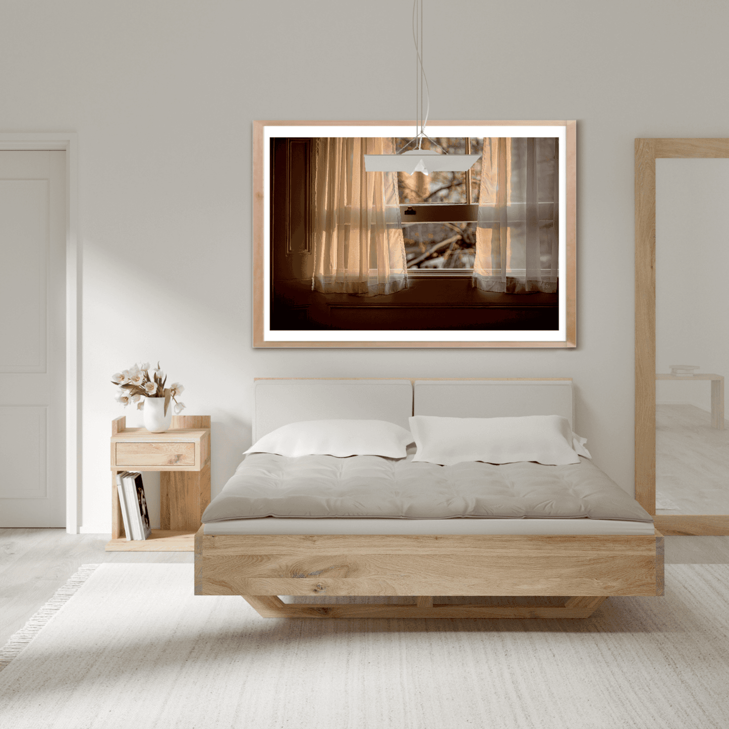 Elegant bedroom decor with framed visual artwork 'From A Window: Golden Light on Lace Curtains in a London Hotel Room' above a wooden platform bed.