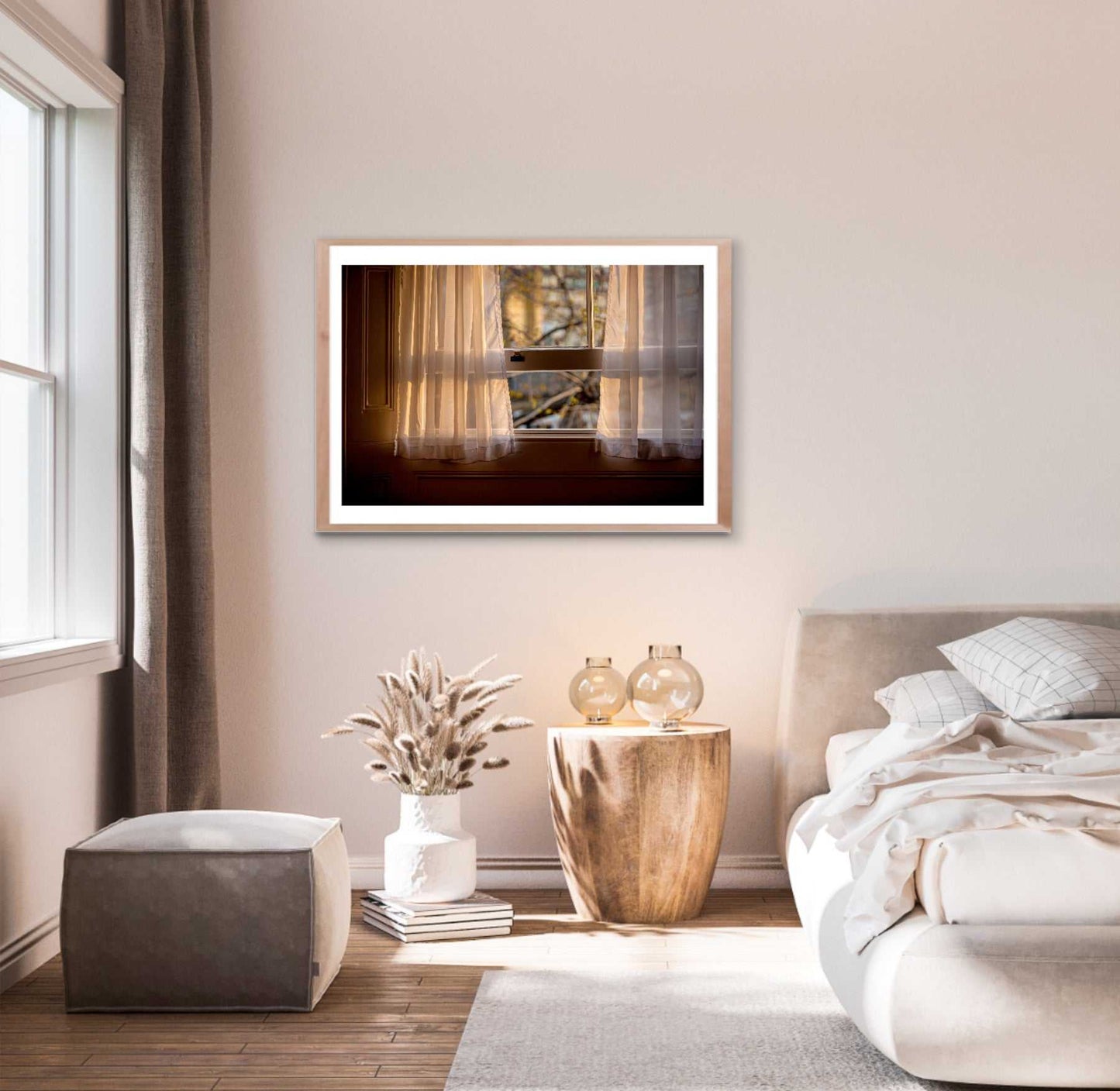 Cozy bedroom interior showcasing 'From A Window: Golden Light on Lace Curtains in a London Hotel Room' fine art print above a rustic nightstand.