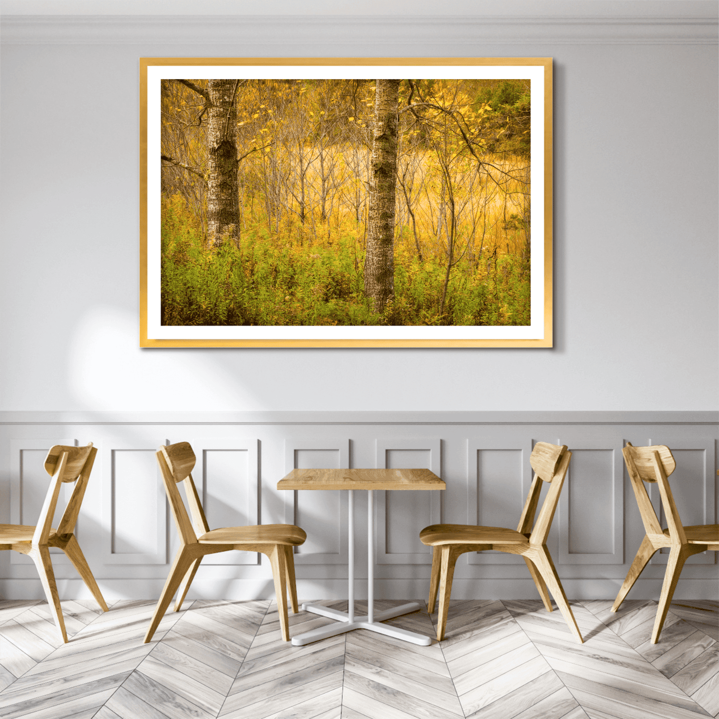 Golden Woods fine art photo displayed in a cozy café setting, adding seasonal charm with golden foliage and layered forest textures from Maine.