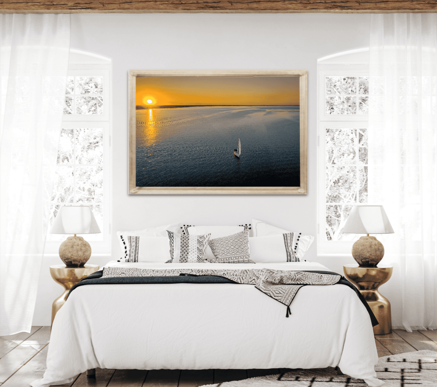Sunset Sail – Fine Art Aerial Photograph Over Galveston Bay framed above a modern white bed. Coastal wall art enhances serene bedroom decor.
