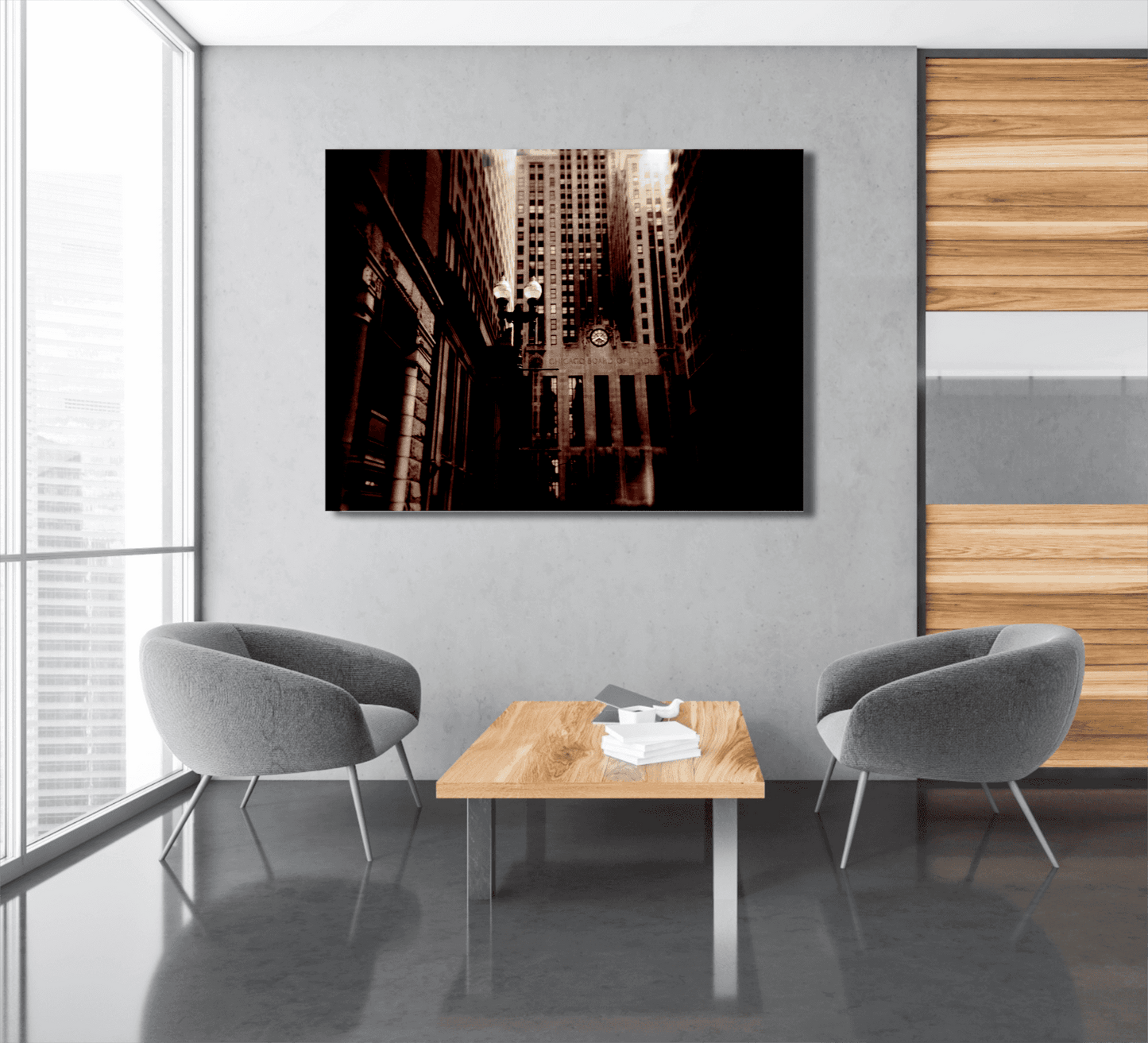 Large sepia Holga photo of Chicago Board of Trade displayed in a minimalist lounge area with gray chairs and wood coffee table.