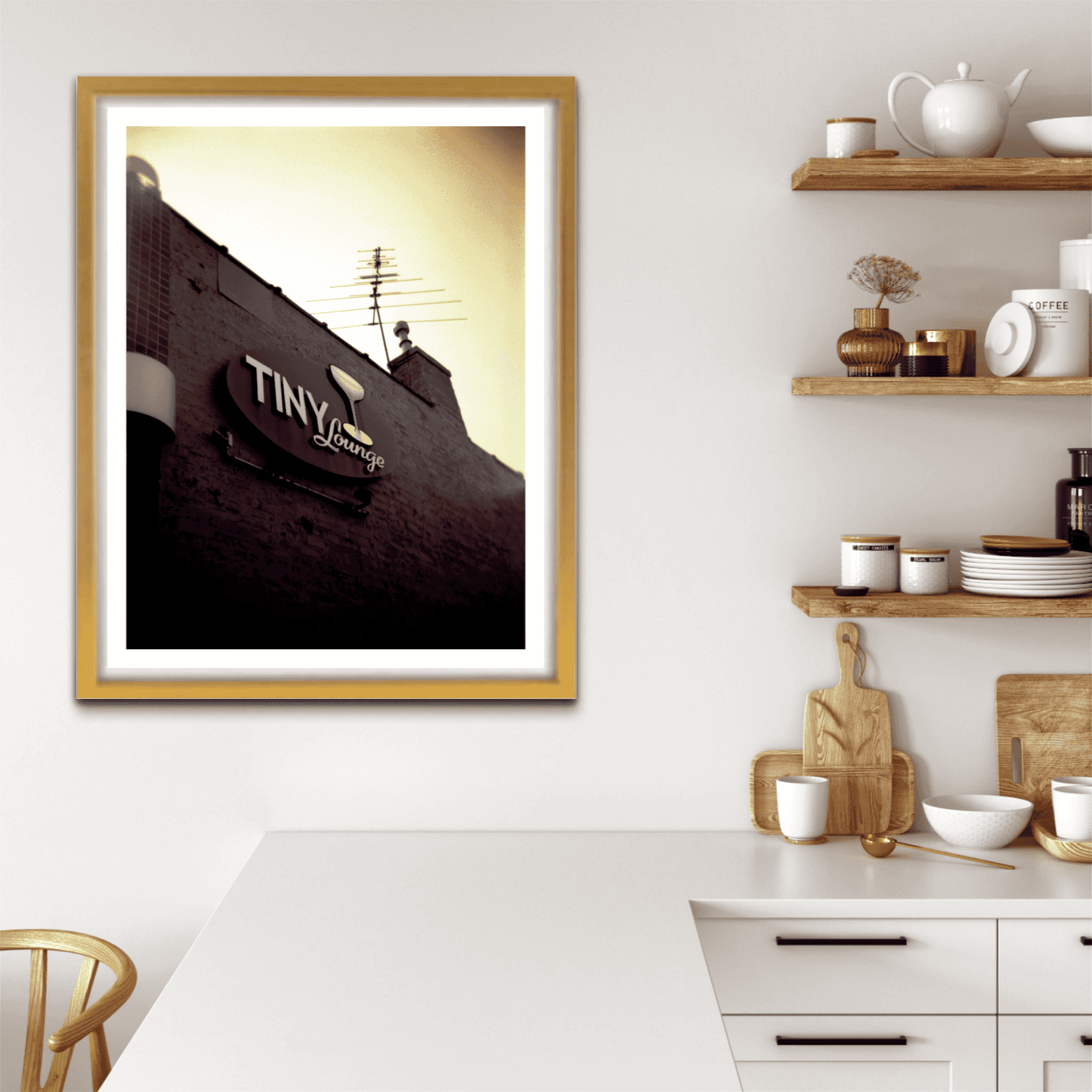 A print of an image, shot on a Holga camera, of the signage at The Tiny Lounge, an iconic small bar that used to exist in Chicago, Illinois, shown on the wall of a room setting