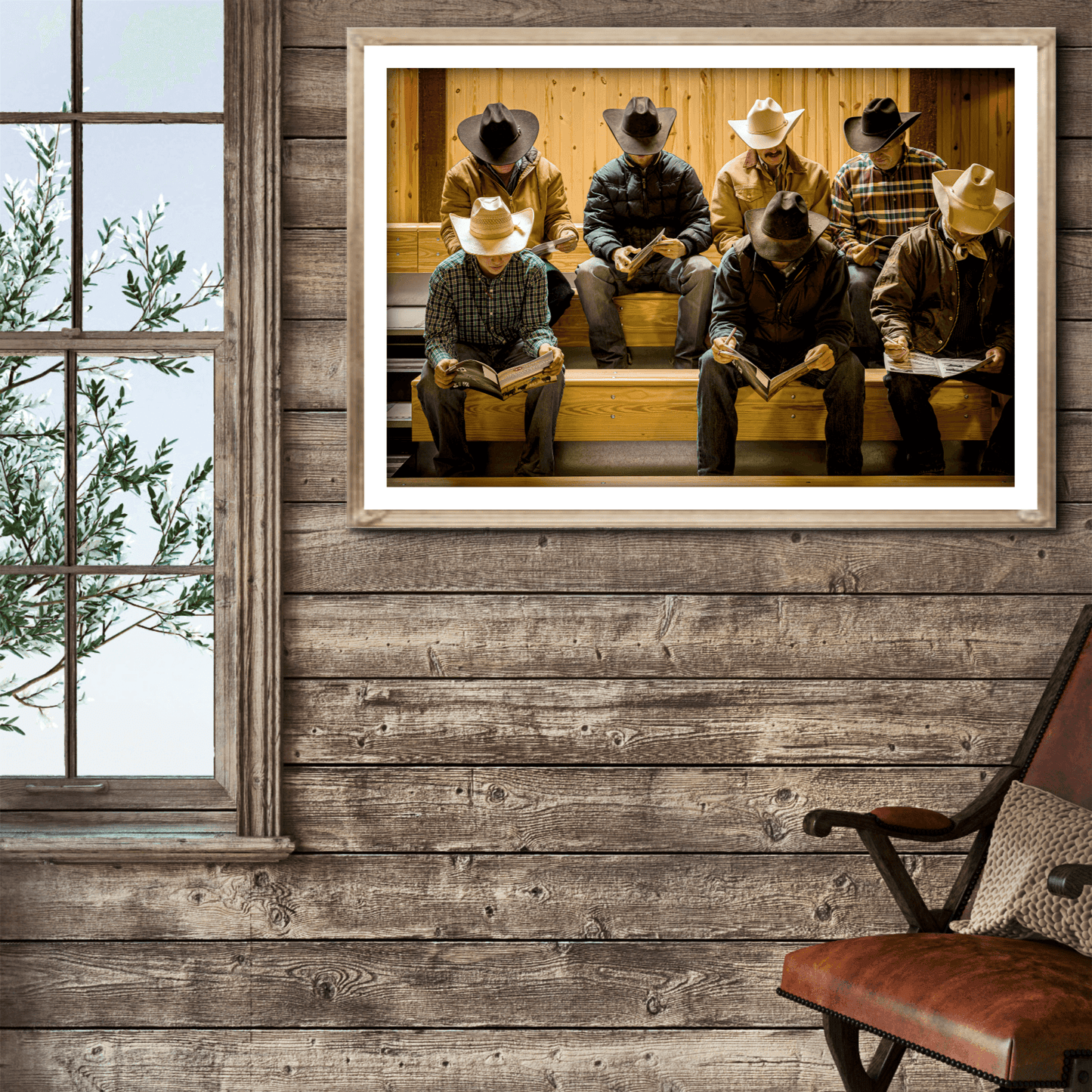 Before the Sale cowboy hat fine art print displayed in a rustic cabin-style room with wood walls and a leather chair, evoking ranch life.