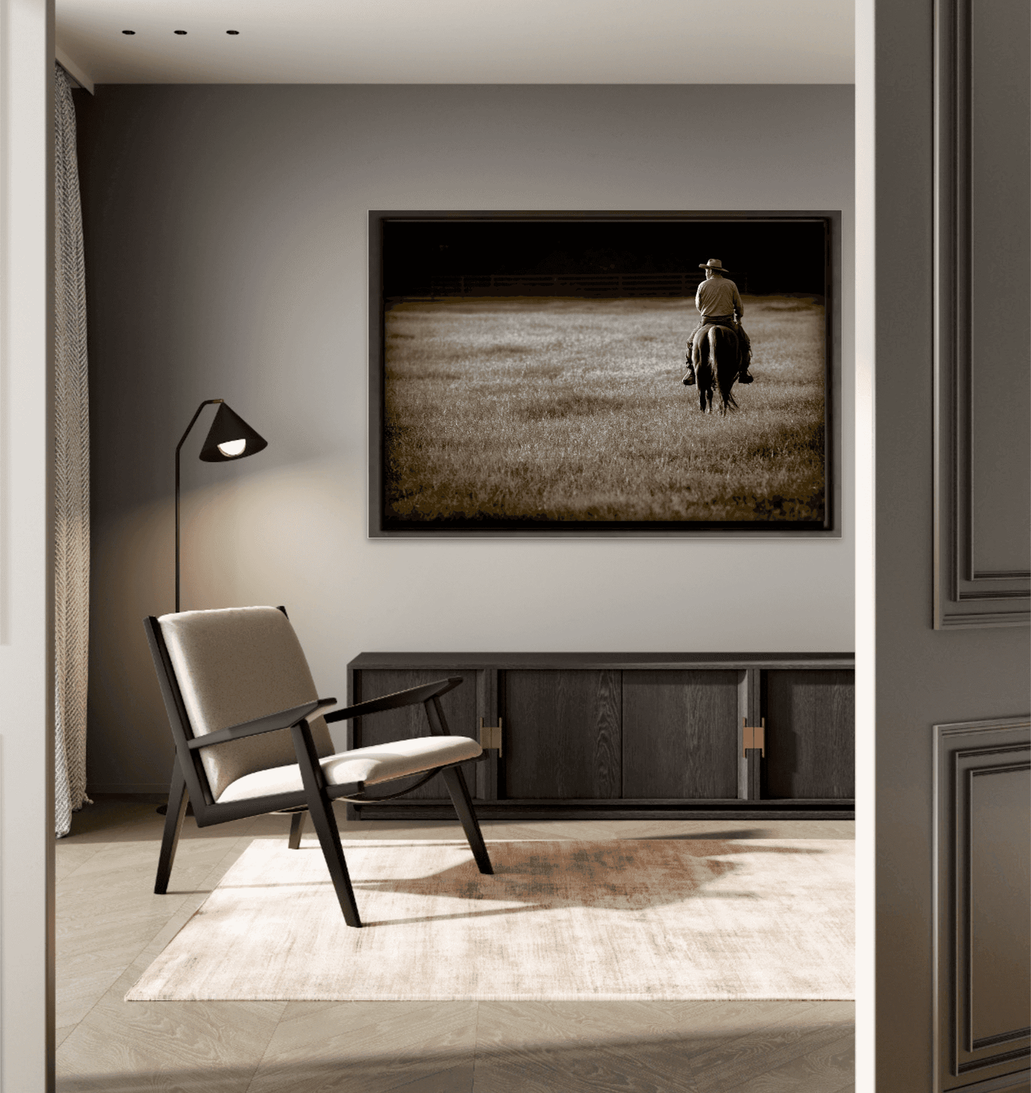 The Lone Rider western wall art in a cozy reading nook, featuring a Texas cowboy riding at sunset. Fine art ranch photography for interior design.