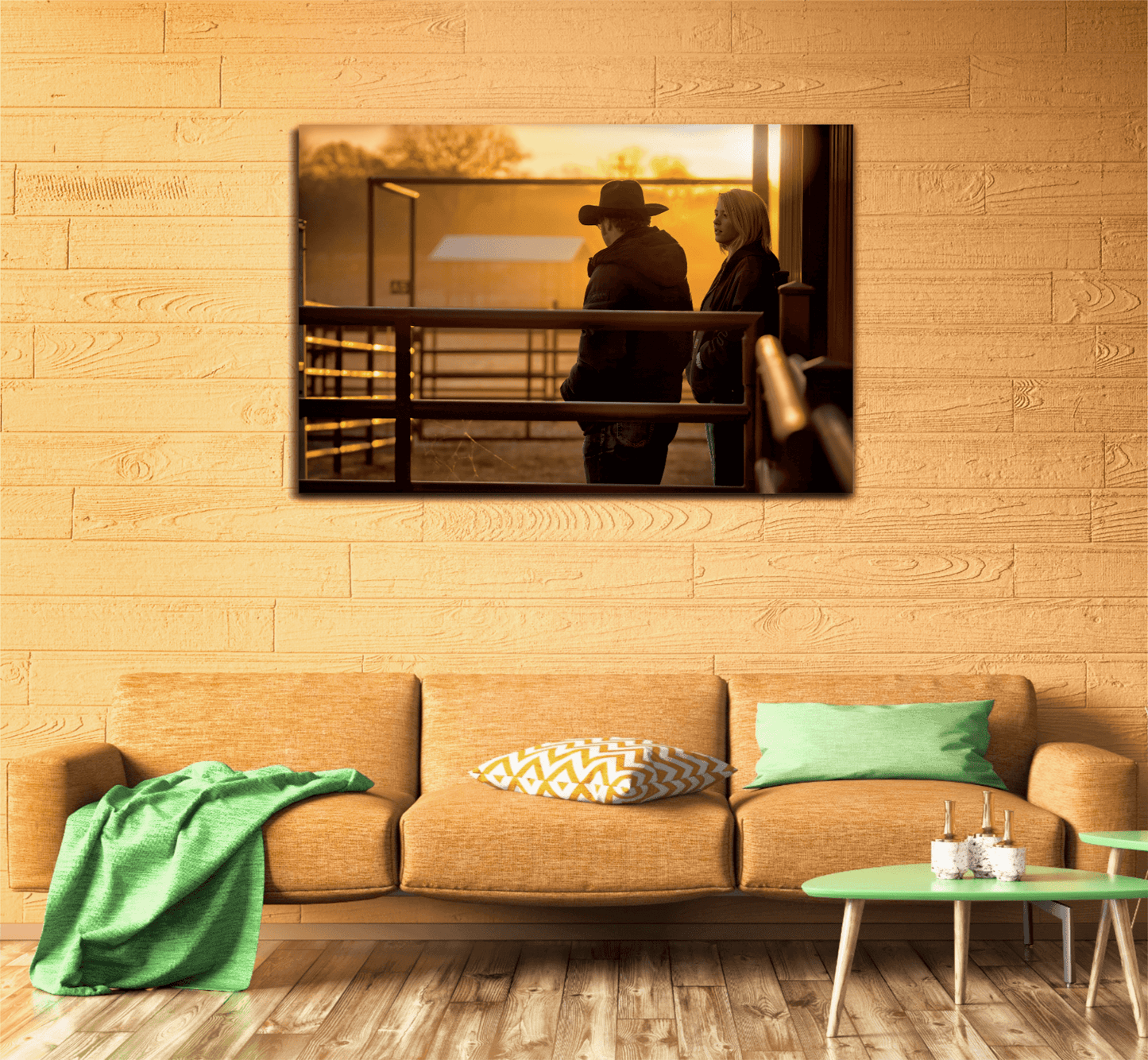 Corral Sunrise ranch scene print on a wood-paneled wall, complementing a Southwestern-style room with green and orange accents.