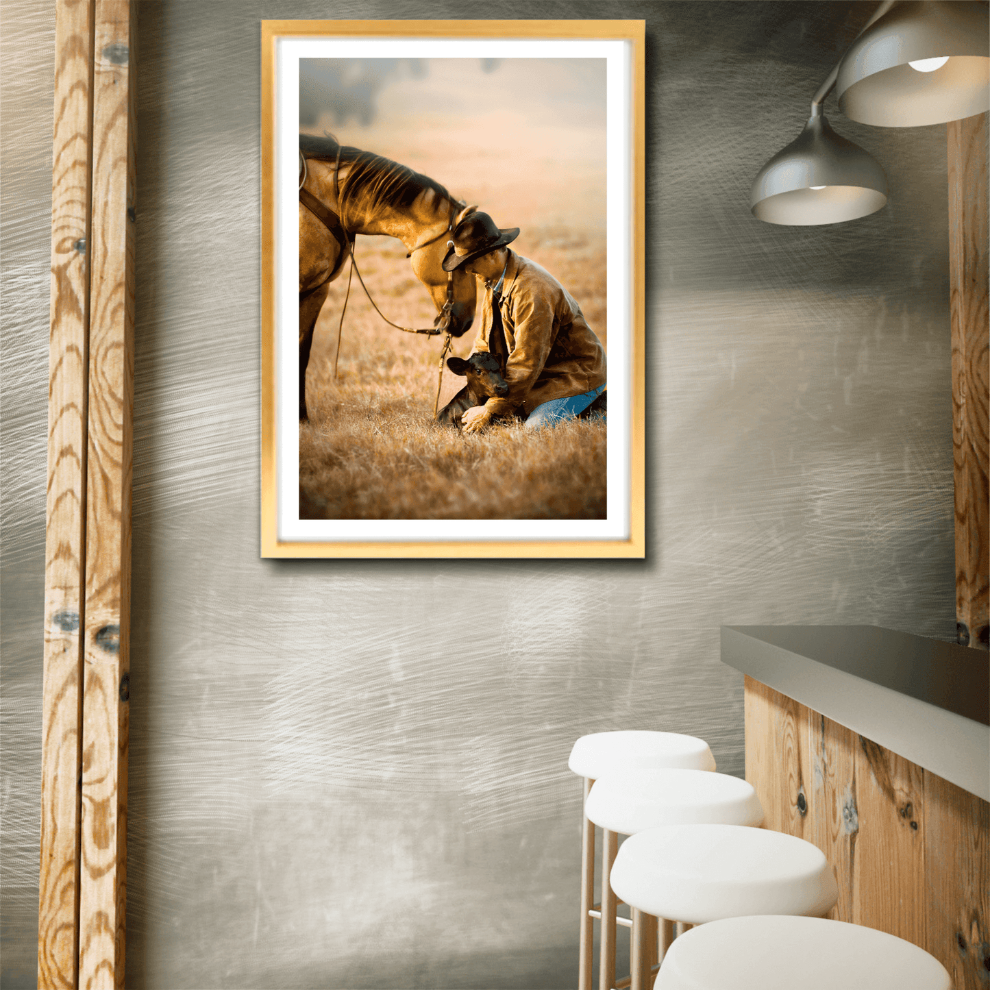 Framed cowboy and calf rescue artwork displayed in a modern rustic kitchen, showcasing Texas ranch life at golden hour for home decor inspiration.