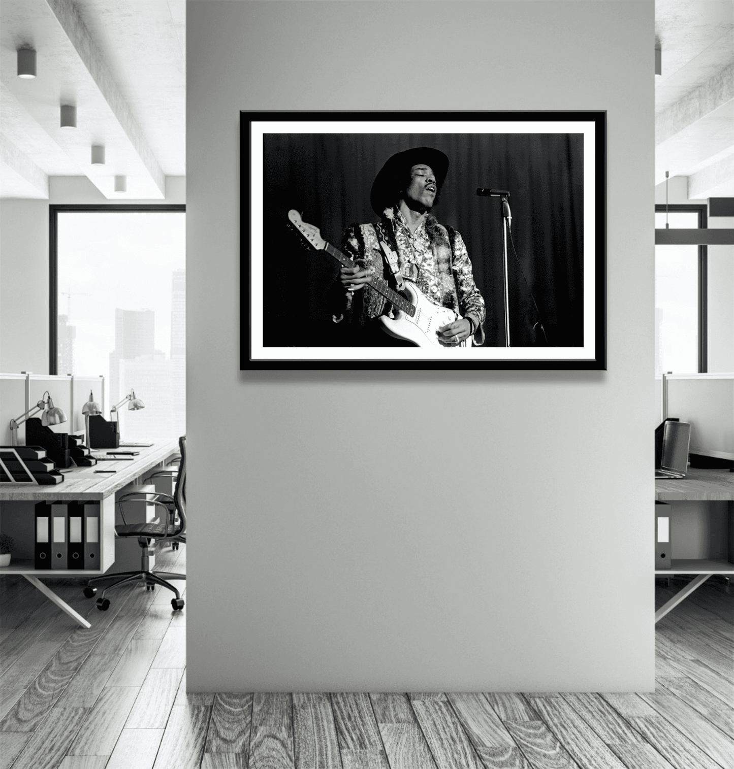 Office space with framed black and white Jimi Hendrix live performance photo, ideal for music history enthusiasts and creative workspaces.
