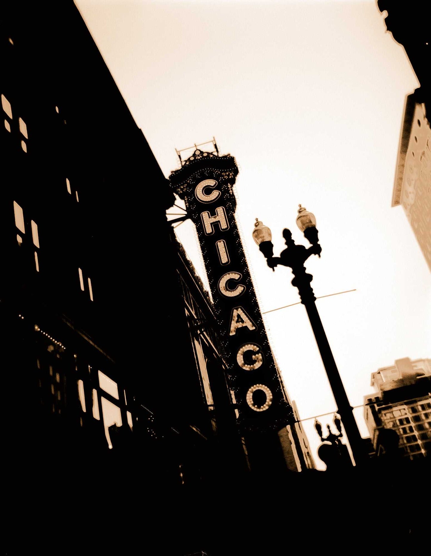 Chicago Theatre – Chicago Landmark fine art photograph by Michael Hart featuring sepia-toned Holga image of iconic marquee in vertical composition.