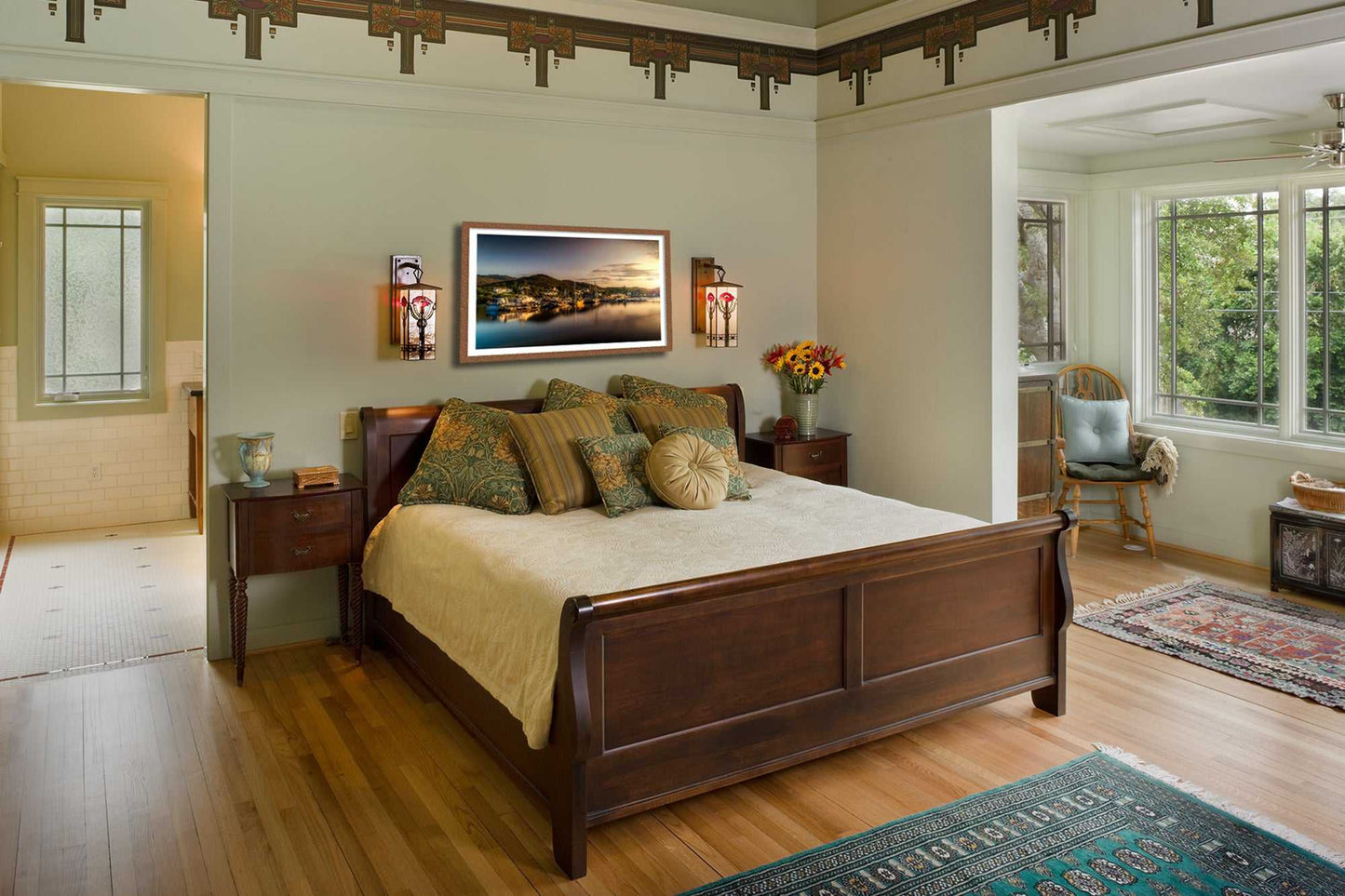 Golden Light over Kyleakin Harbor – Isle of Skye Landscape Image displayed above a wooden bed in a cozy, light-filled bedroom with vintage decor.
