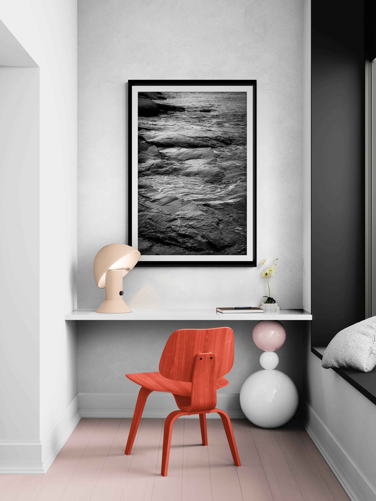 Grey Atlantic #3 – Vertical black and white ocean landscape print styled in a modern reading nook, ideal for nature-inspired home decor.