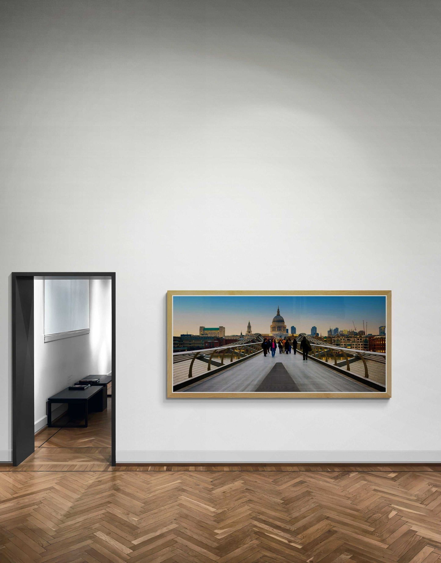 Millennium Bridge-London Landmark Fine Art Print by Michael Hart framed in a minimalist interior, capturing twilight walk toward St. Paul’s Cathedral in London.