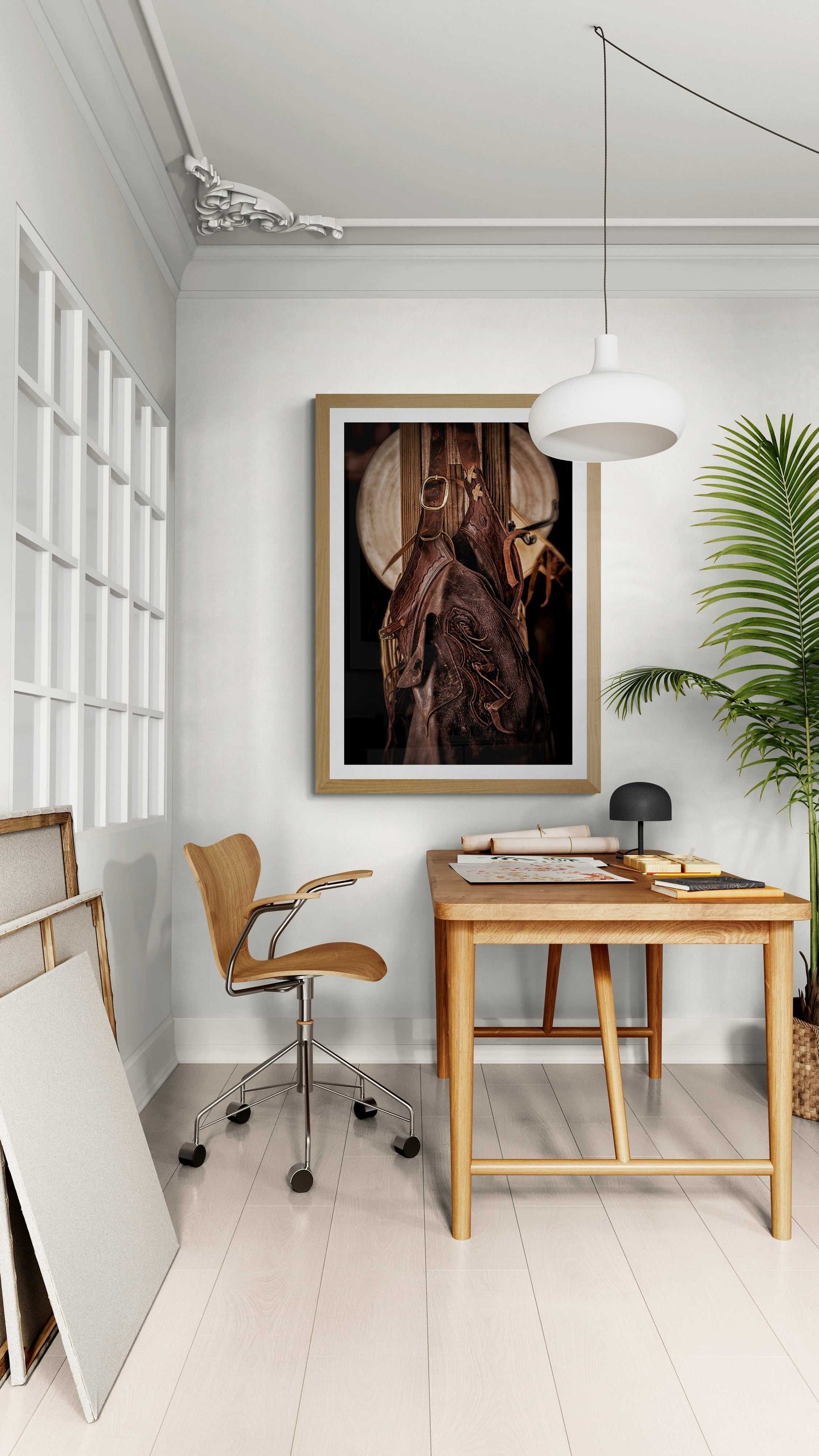 Western fine art photo of cowboy tack and hat framed in a bright home office, blending rustic Texas ranch style with modern decor.