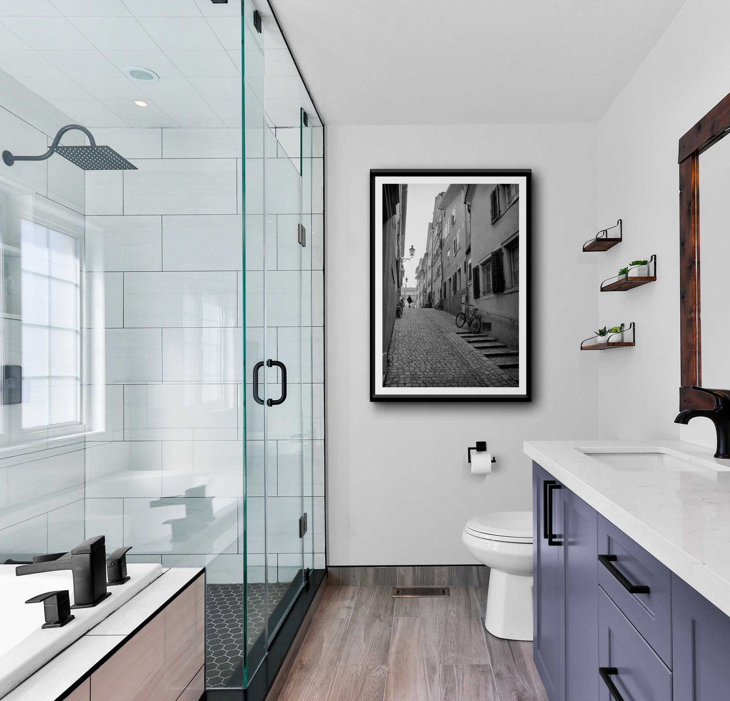 Zurich Series #5 black and white fine art print by Michael Hart featured in a contemporary bathroom. European cobblestone street scene adds sophistication to decor.
