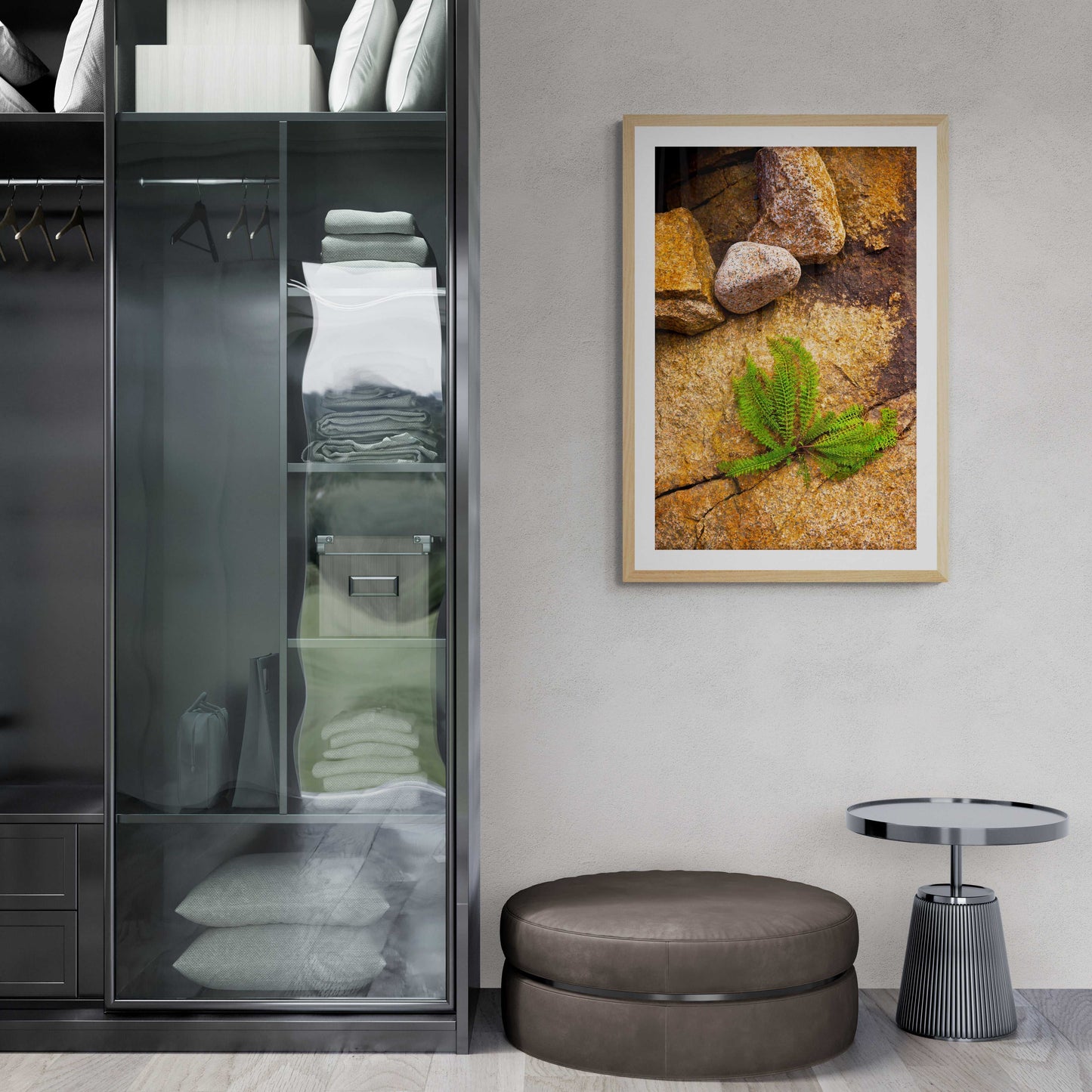 Framed Nature Breaking Through Stone print in contemporary closet area, capturing vibrant green plant in Maine rock crevice with earthy background.