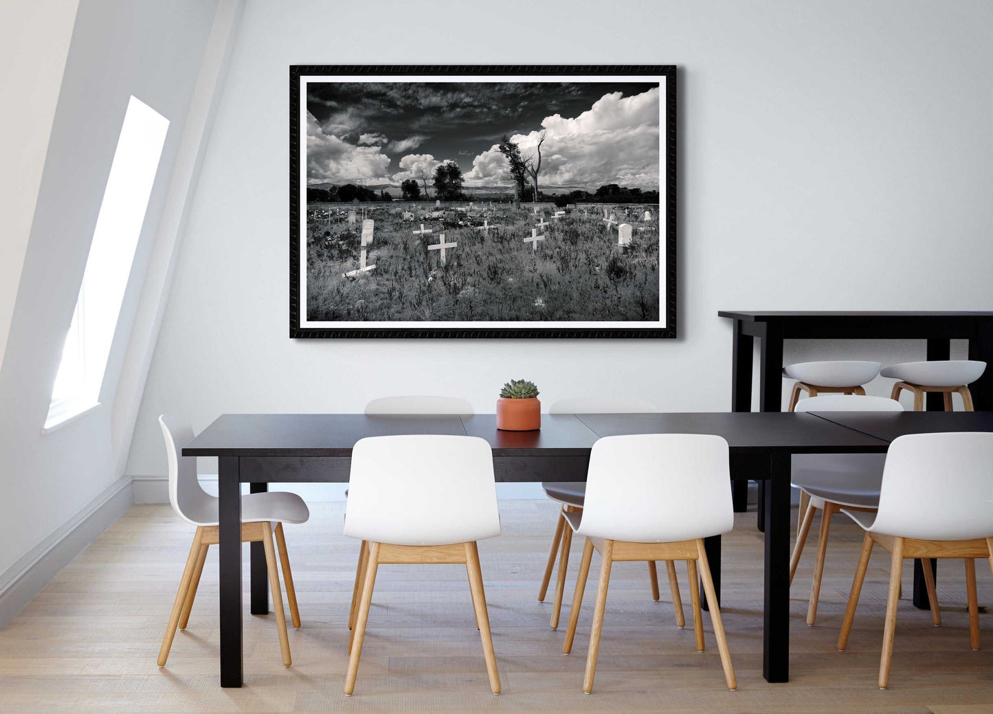 Fort Washakie Cemetery fine art print in bright dining area, combining Western landscape photography with clean, modern interior design.