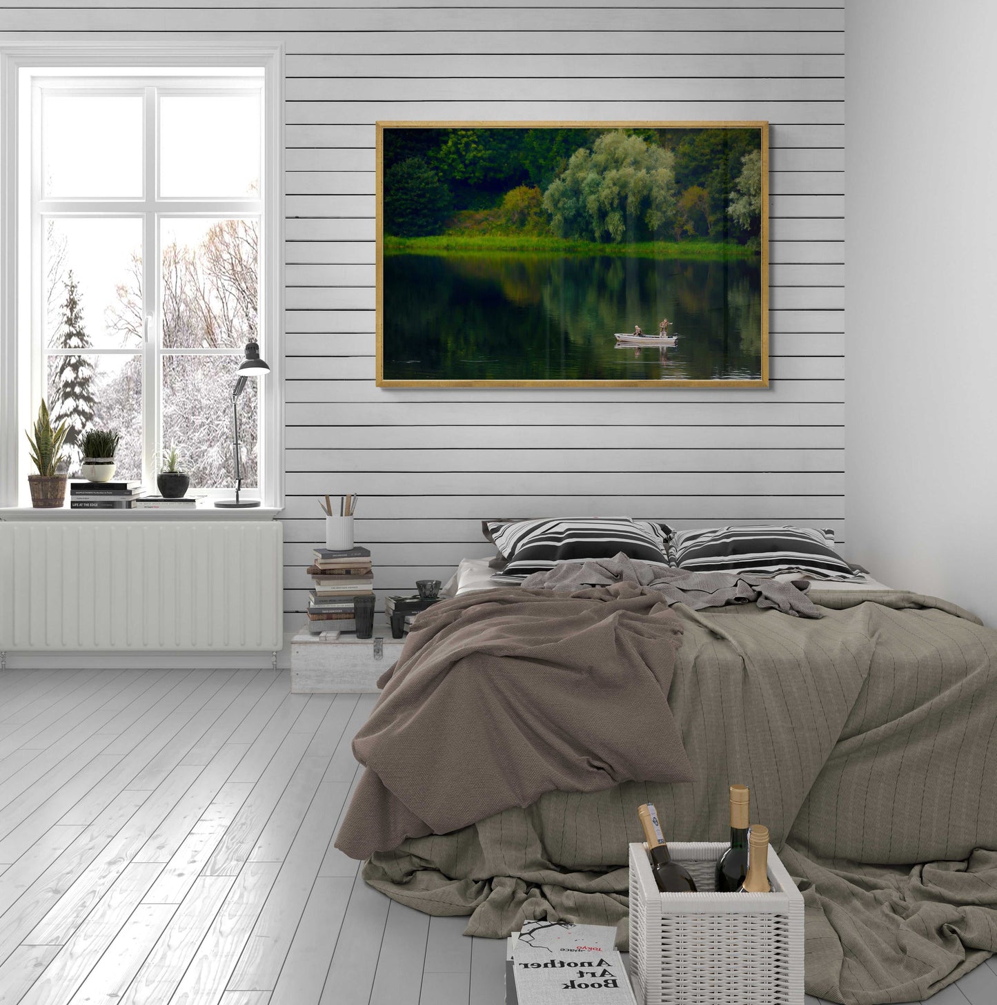 Fishermen on Linlithgow Loch – A Scene of Light, Gesture, and Color framed art print displayed above a bed in a modern rustic bedroom. The tranquil lake scene enhances the serene interior decor with its lush greenery and reflective water.
