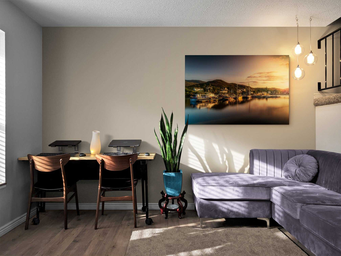 Golden Light over Kyleakin Harbor – Isle of Skye landscape image displayed in a modern living room with a gray sectional and wood desk setup. The fine art print adds a warm, serene touch to the home decor.