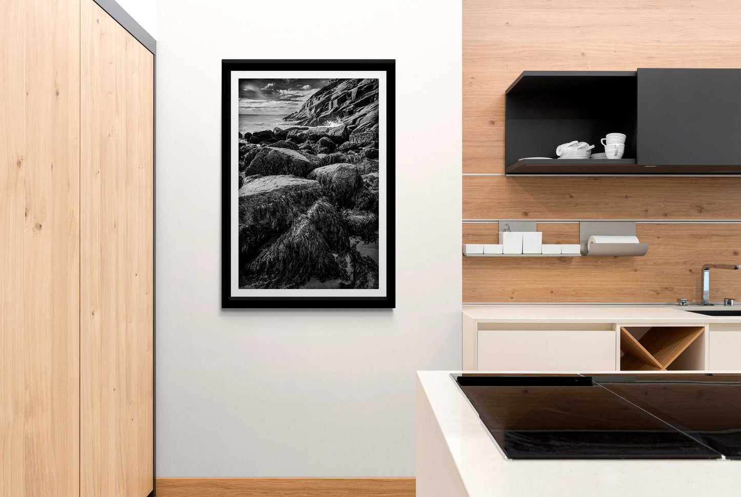 After Doré – Moody Black and White Coastal Photography mounted in a minimalist kitchen, blending fine art photography with contemporary interior style.
