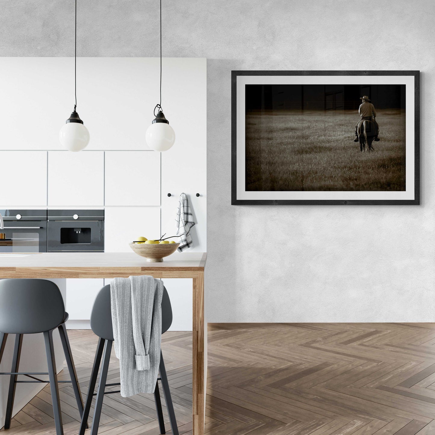 The Lone Rider fine art print displayed in a modern kitchen, showcasing Texas cowboy on horseback at sunset. Western wall art for home decor.
