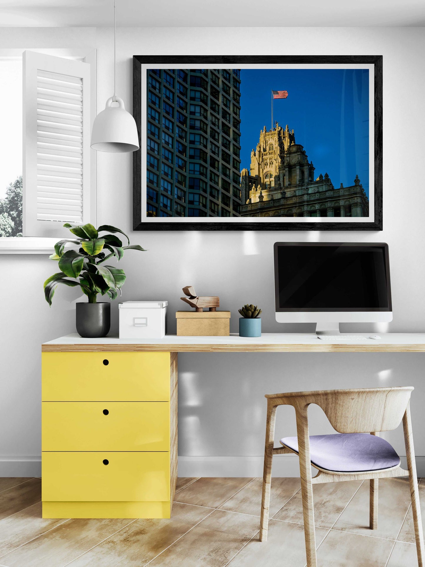 Framed Chicago Tribune Tower summer flag photo by Michael Hart displayed above desk in modern home office. Limited edition architectural wall art.