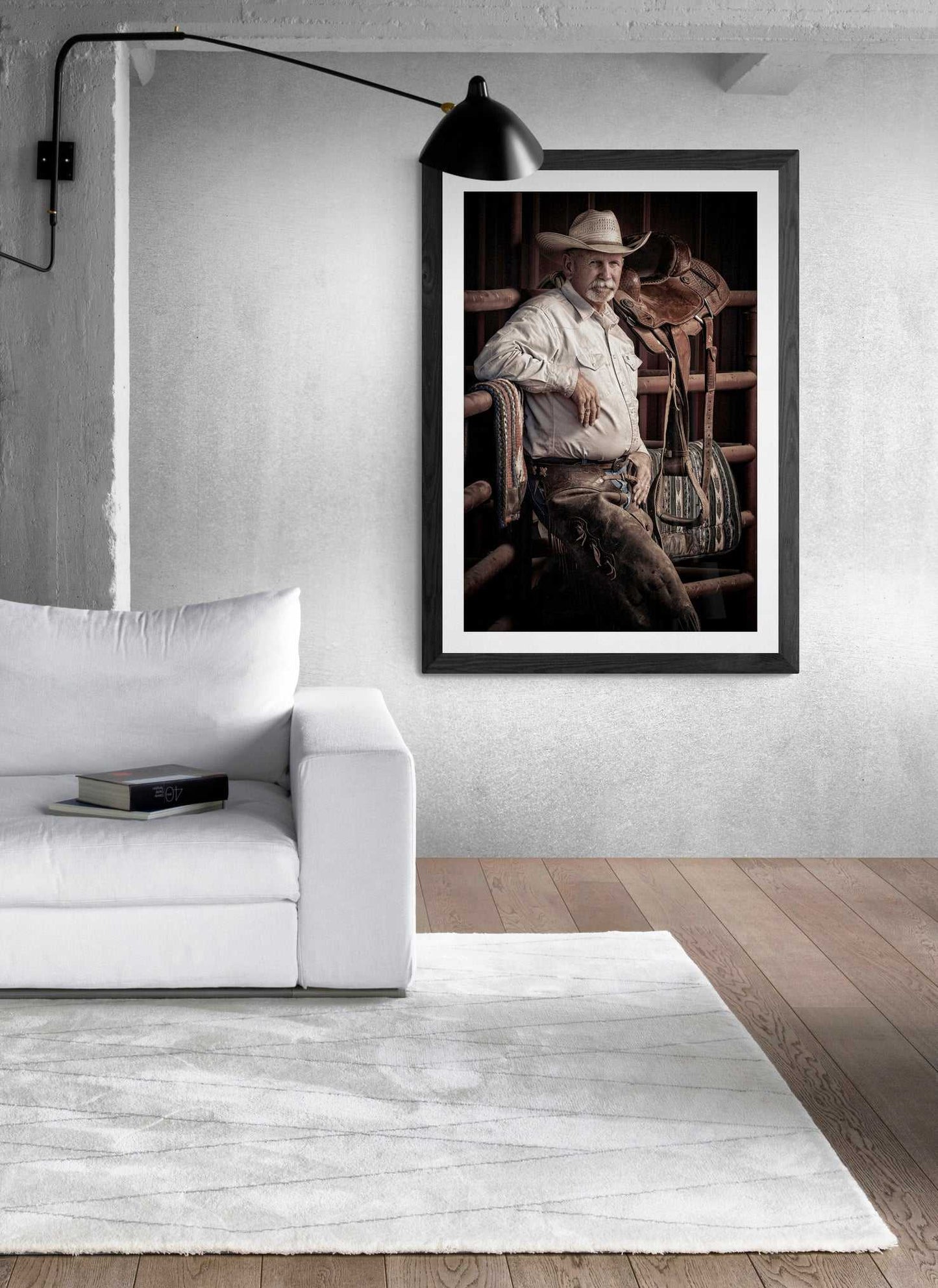 Minimalist room with The Foreman-A Portrait of A Texas Cowboy in black frame, highlighting fine art Texas ranch photography in a modern interior setting.