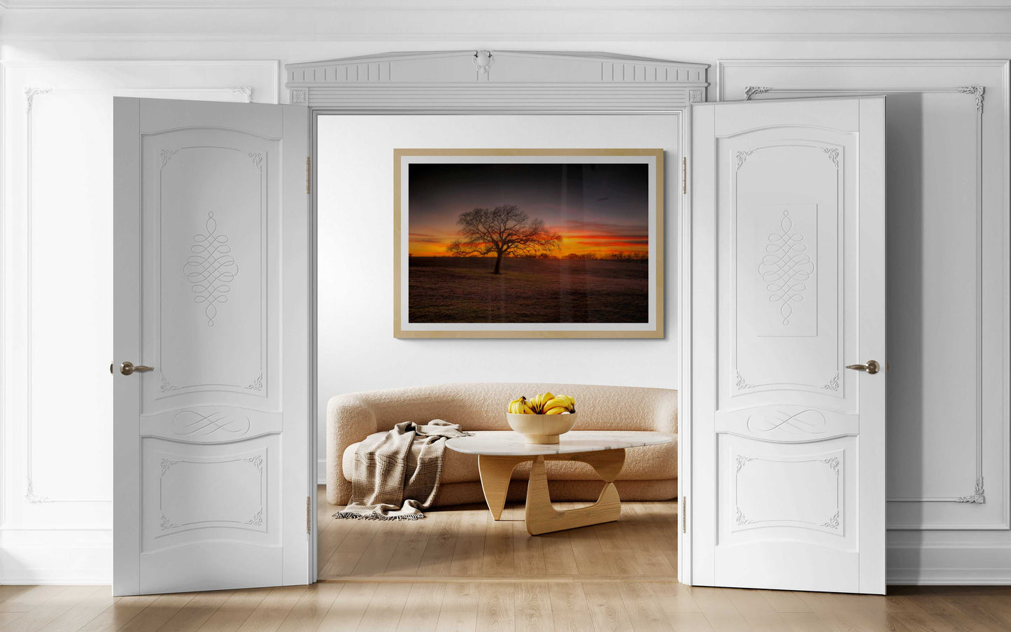 Lone Tree at Sunset – Fine Art Photograph at 44 Farms, Texas Ranch framed in a bright white room above a neutral sofa. Elegant Texas ranch wall art for modern home decor.