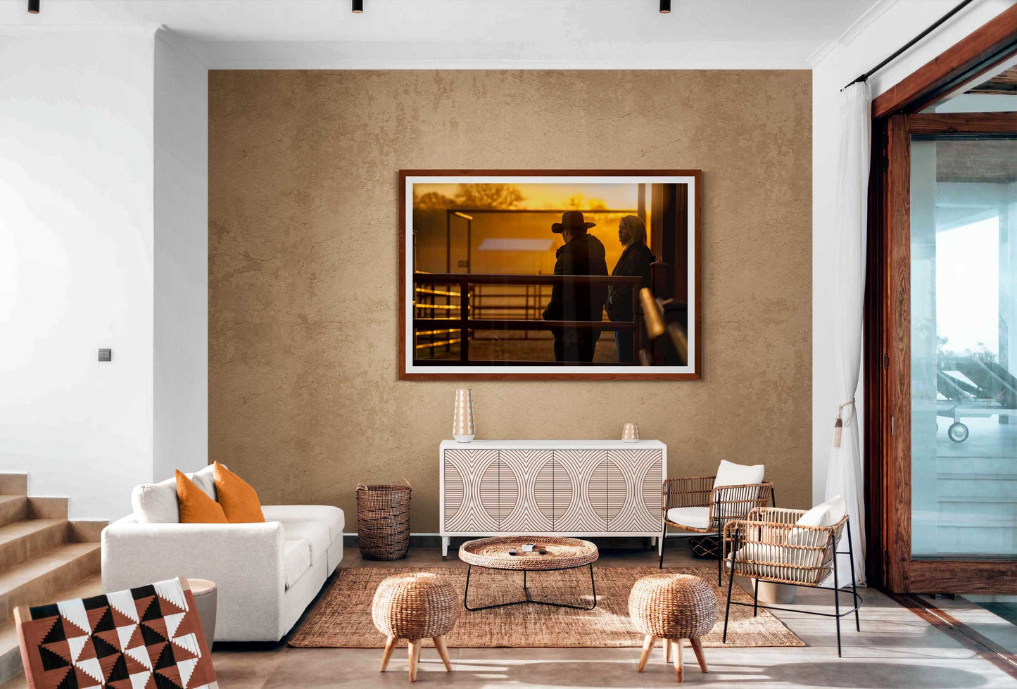 Corral Sunrise cowboy print in a boho-style living room, adding warmth and rural Americana charm to Western lifestyle-inspired home decor.