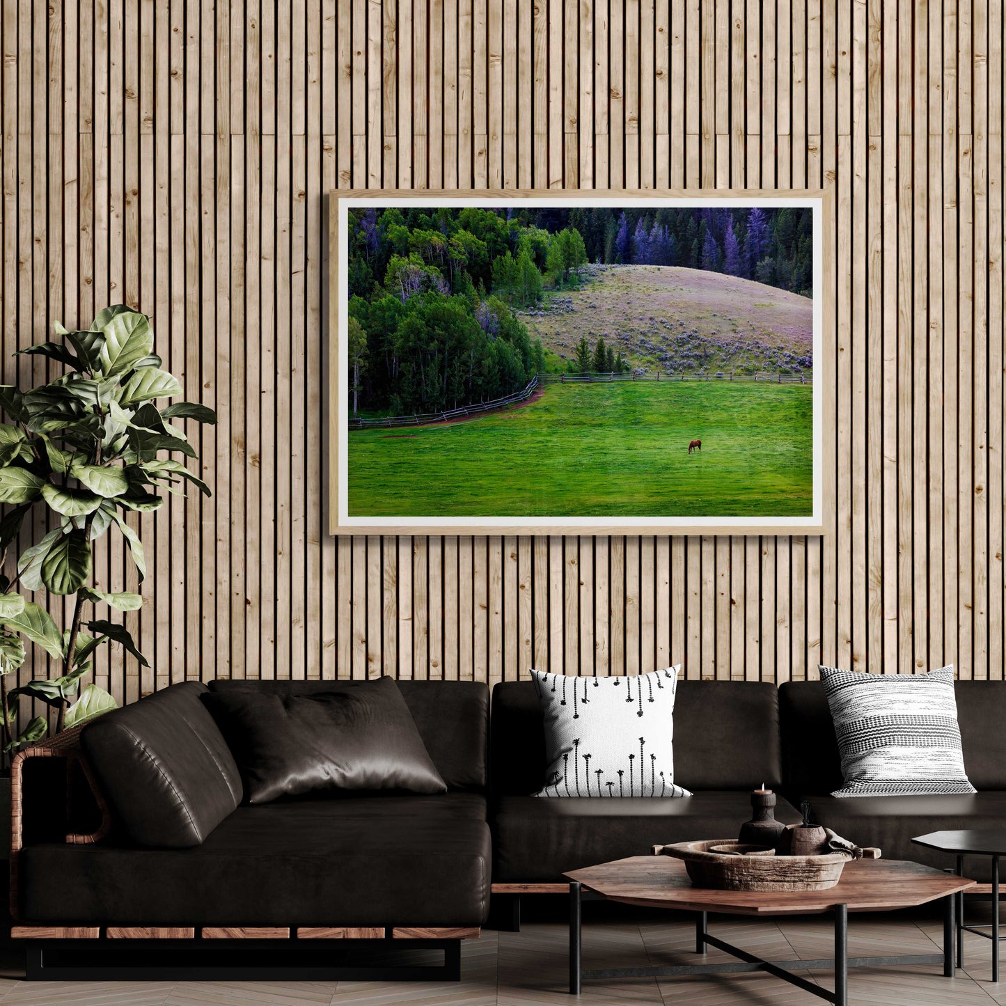 Lone Horse on Gros Ventre Ranch – Fine Art Photograph from Jackson Hole, Wyoming framed on a wood slat wall above a black sofa. Ideal for modern rustic and equine-themed decor.