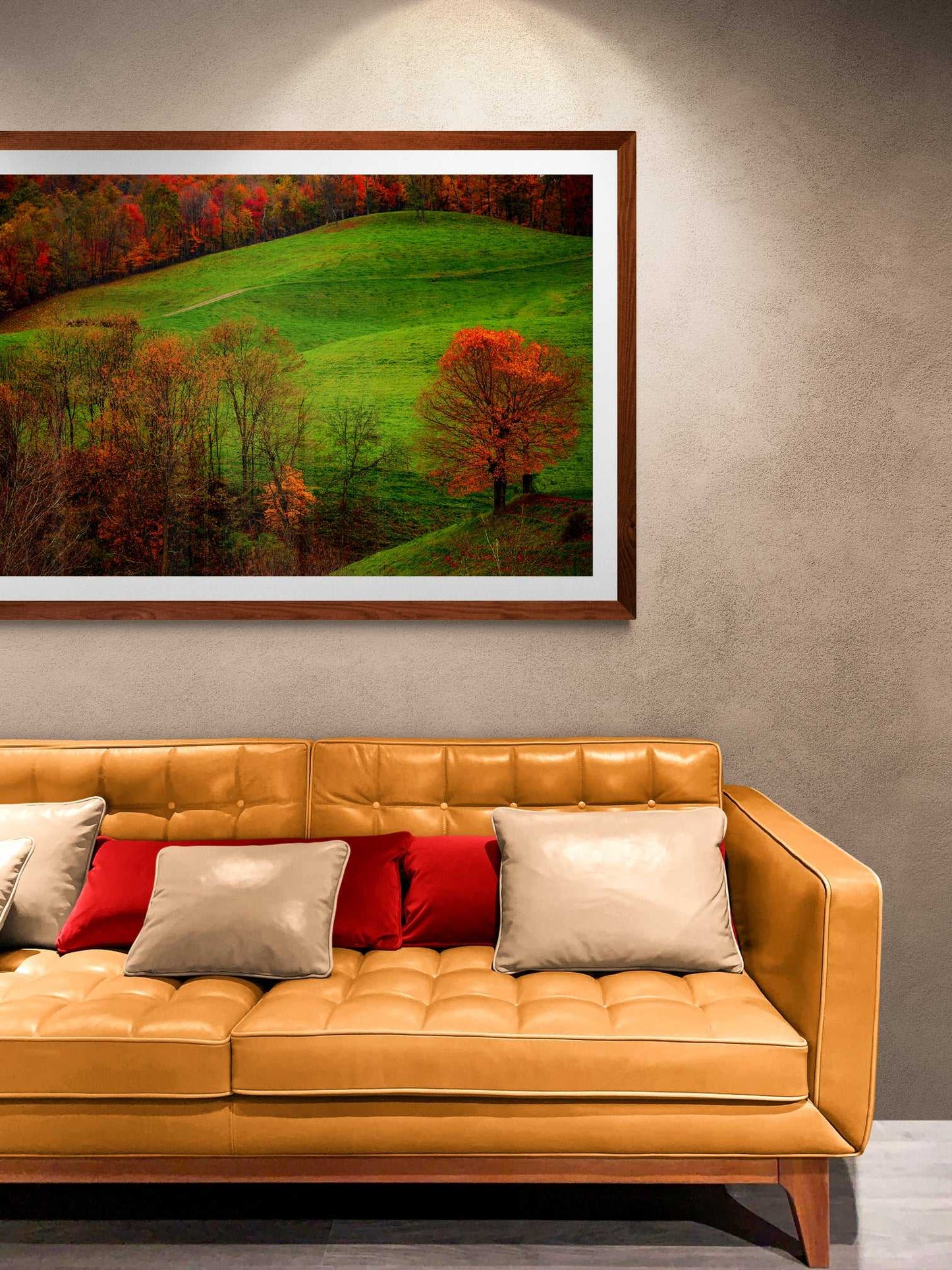 A framed print of West Virginia Autumn hanging on the wall in a room setting