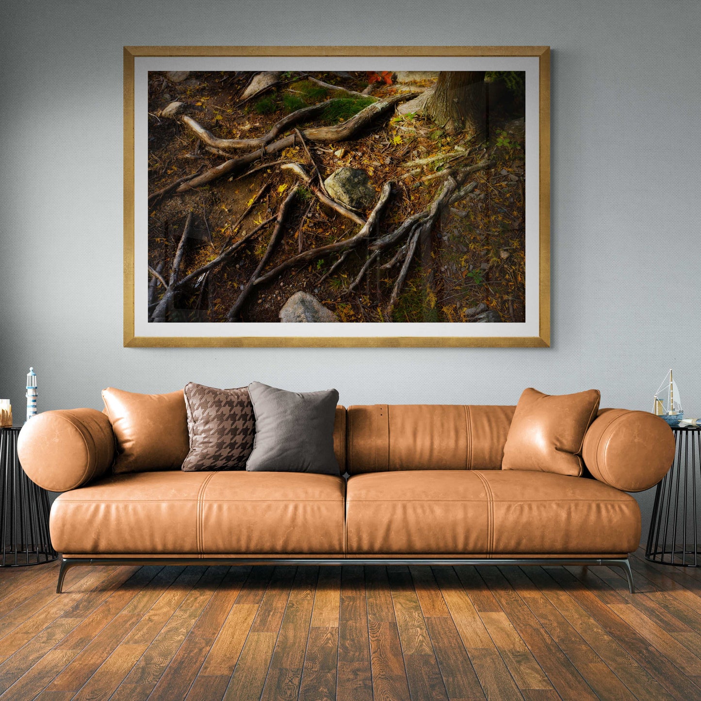 Autumn Roots – Limited edition forest floor photograph featured above a leather sofa, perfect for warm-toned living room wall art.