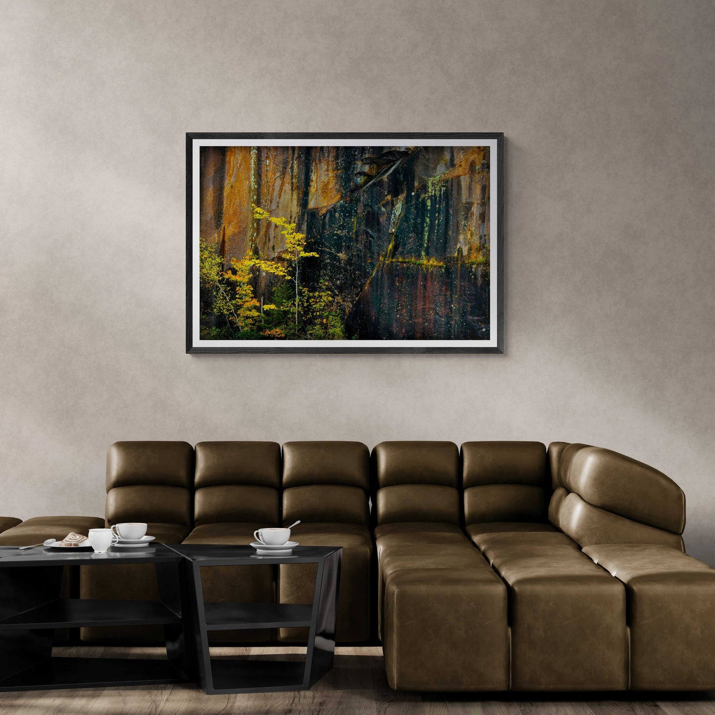 Michael Hart’s Quarry Wall #1 limited edition abstract photo displayed above a brown leather sectional in a modern living room setting.