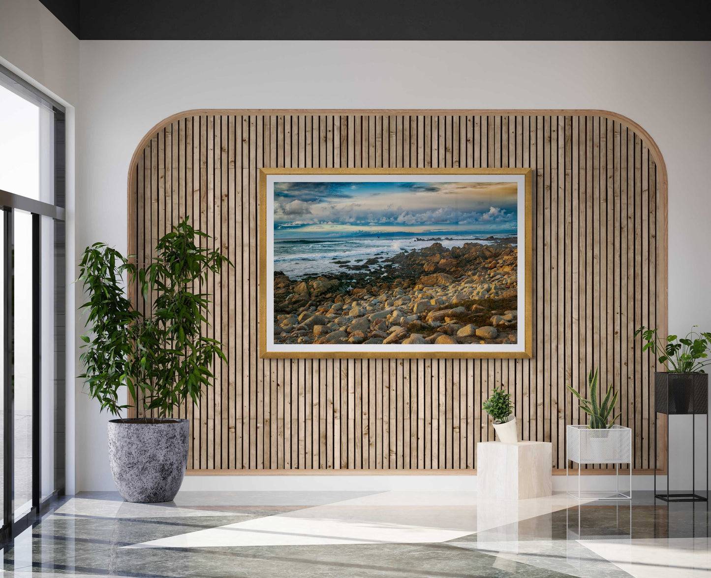 Monterey Bay – Vibrant California Seascape Limited Edition Print by Michael Hart framed in gold and hung on a wood-accented wall in a bright, modern entryway.
