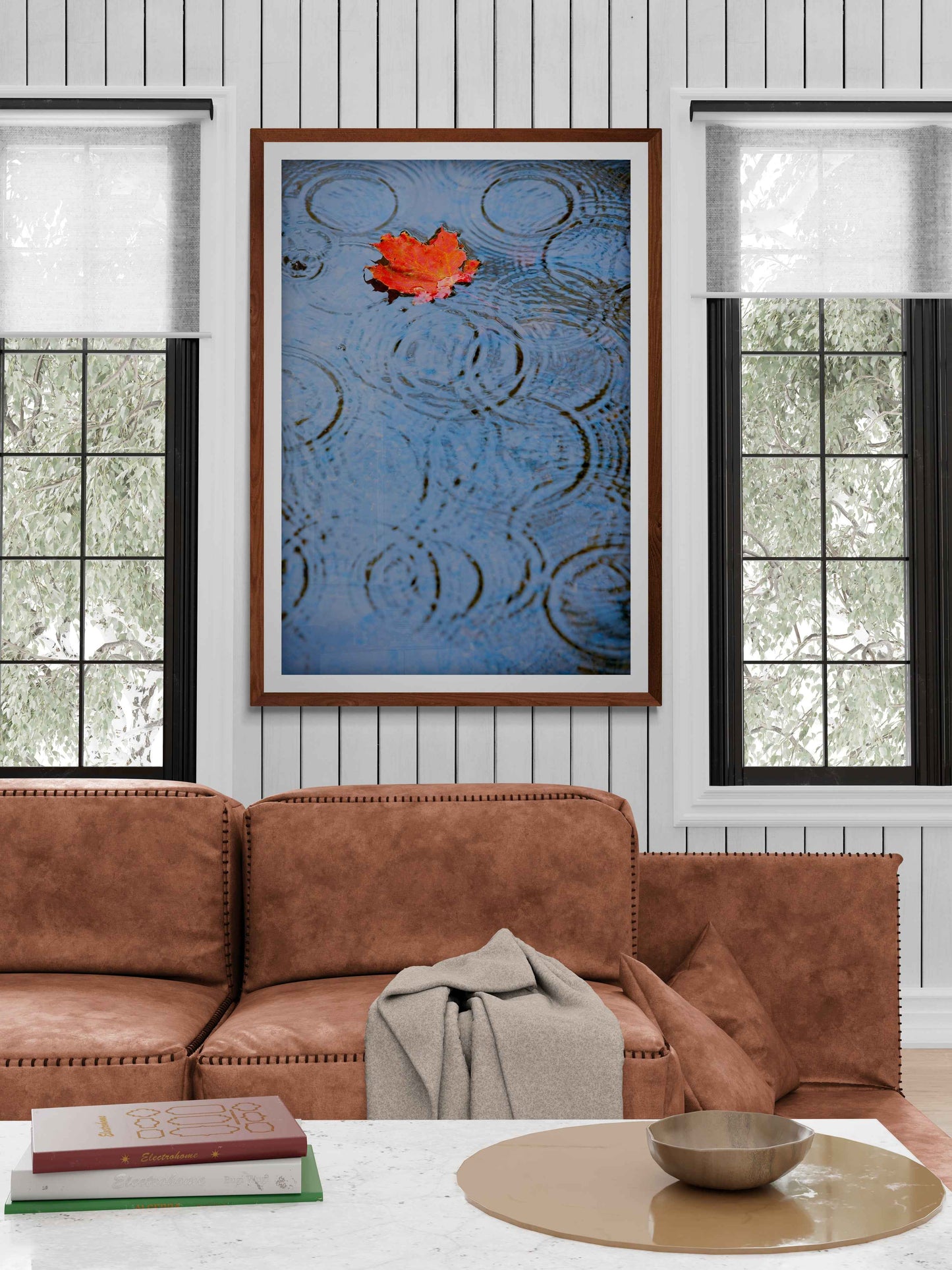 Autumn Rain – Limited Edition Fine Art Photograph framed in a bright living room. The red leaf and rain ripples create a tranquil seasonal focal point.